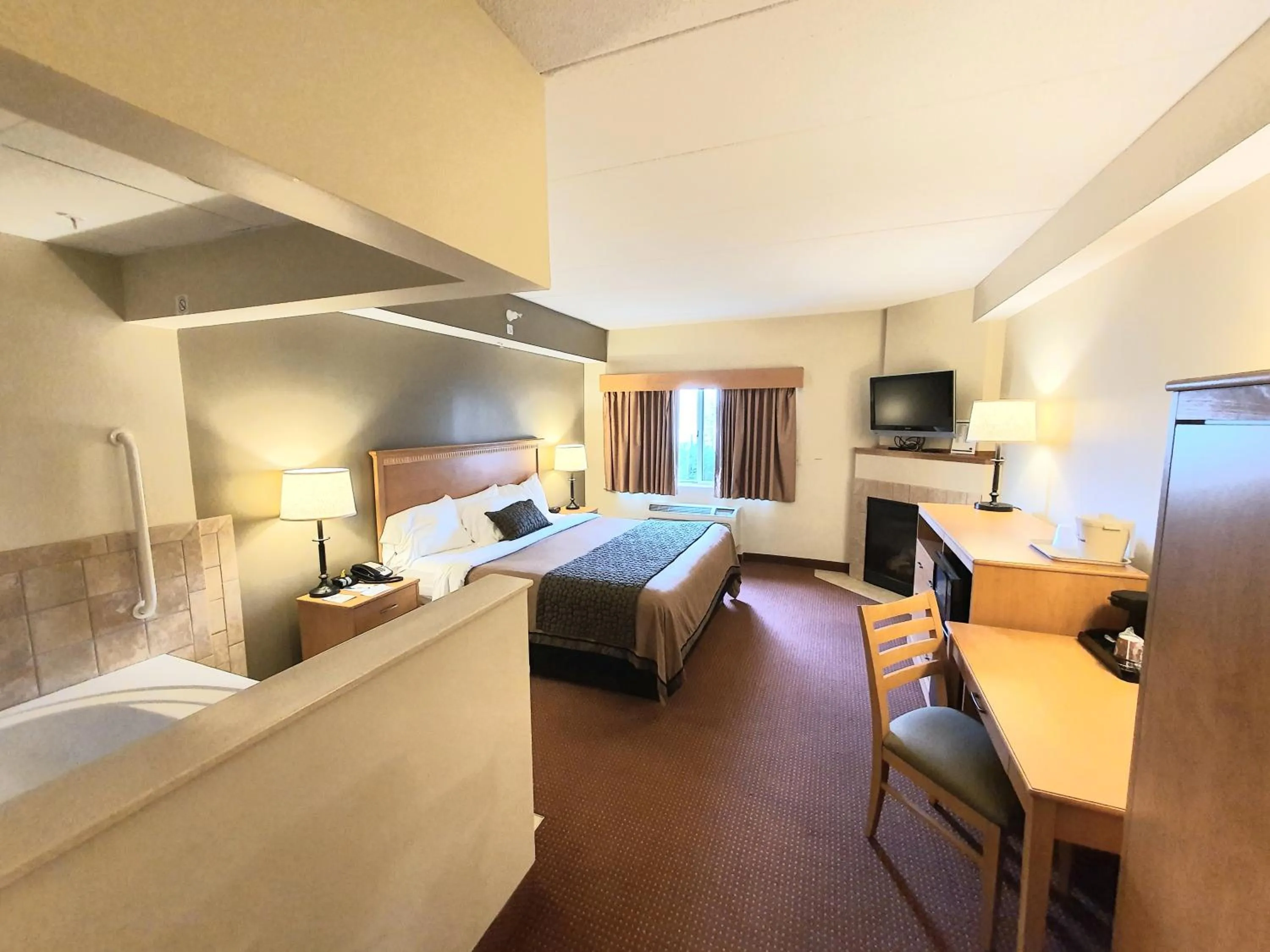 Bed in AmeriVu Inn and Suites - Waconia