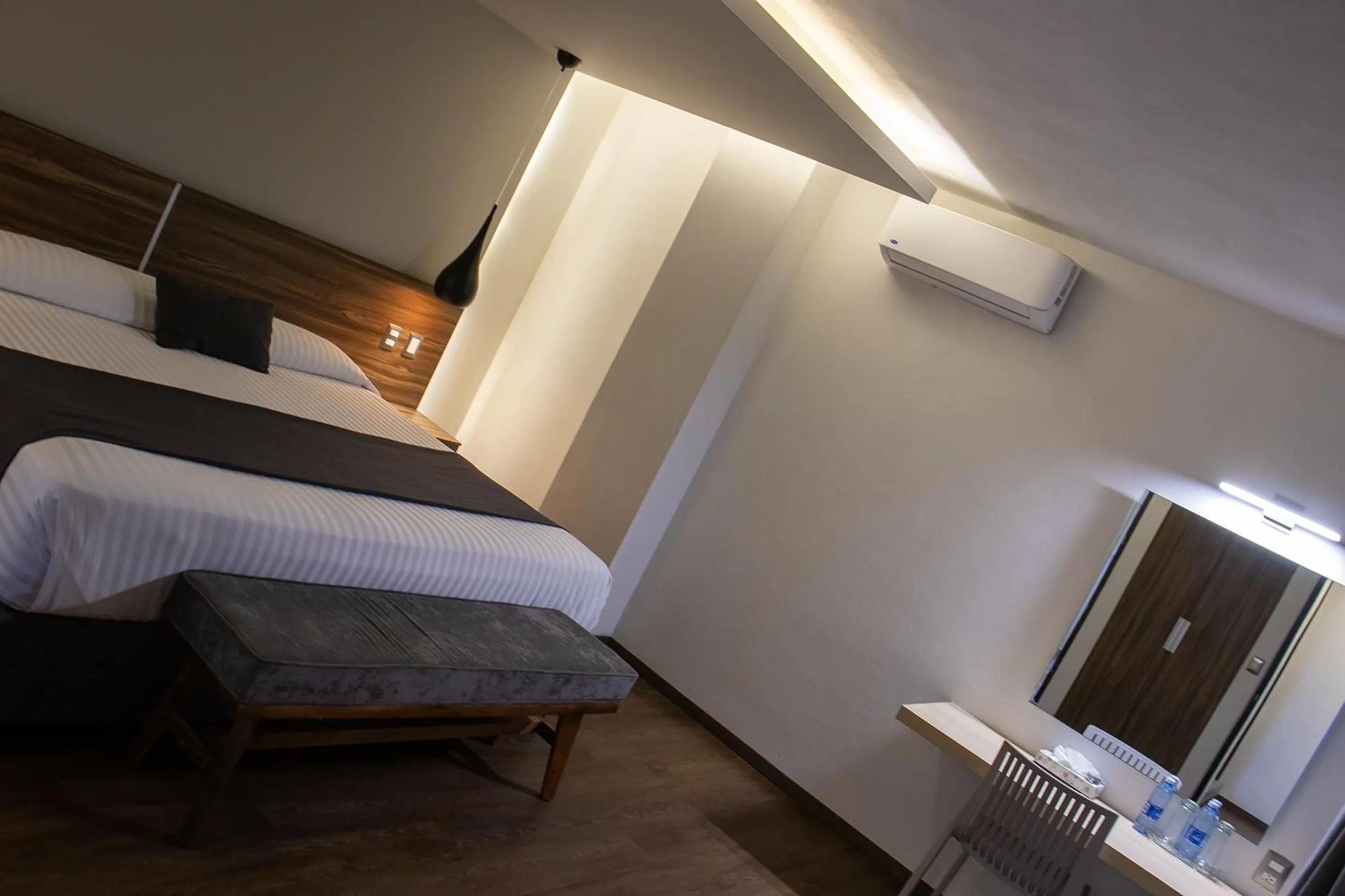 Bedroom, Bed in Estanza Hotel & Suites