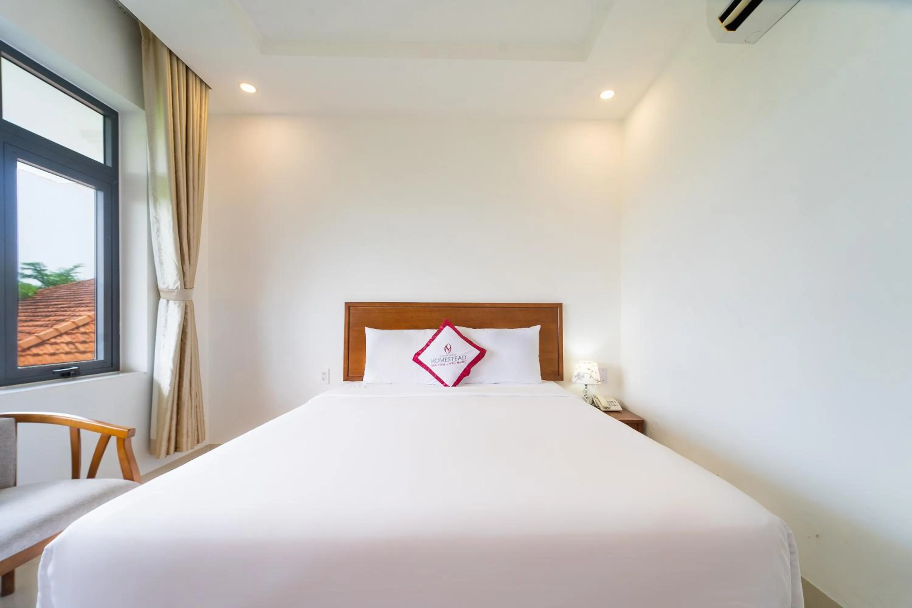 Bed in Homestead Seaview Phu Quoc Hotel
