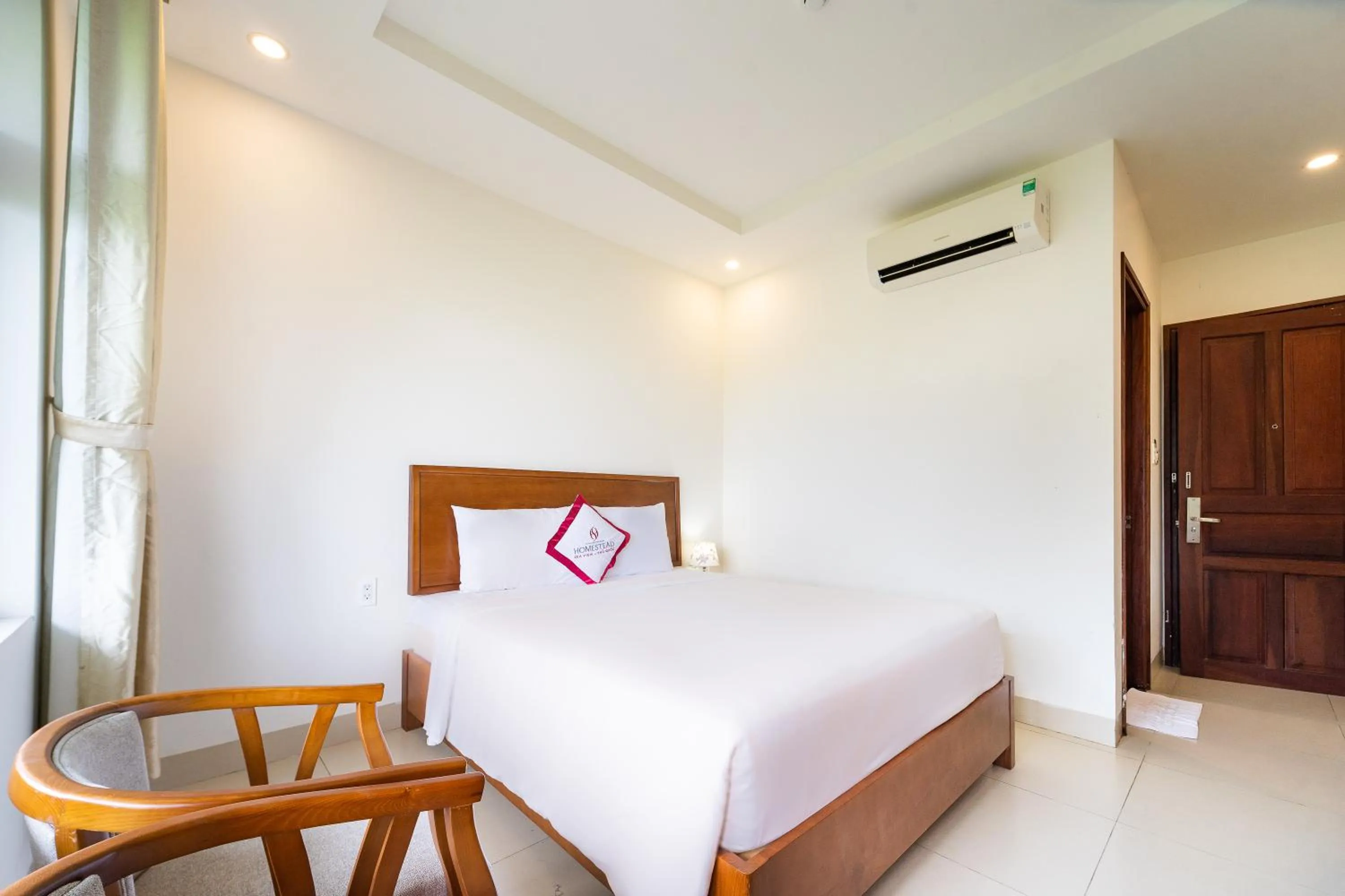 Bed in Homestead Seaview Phu Quoc Hotel
