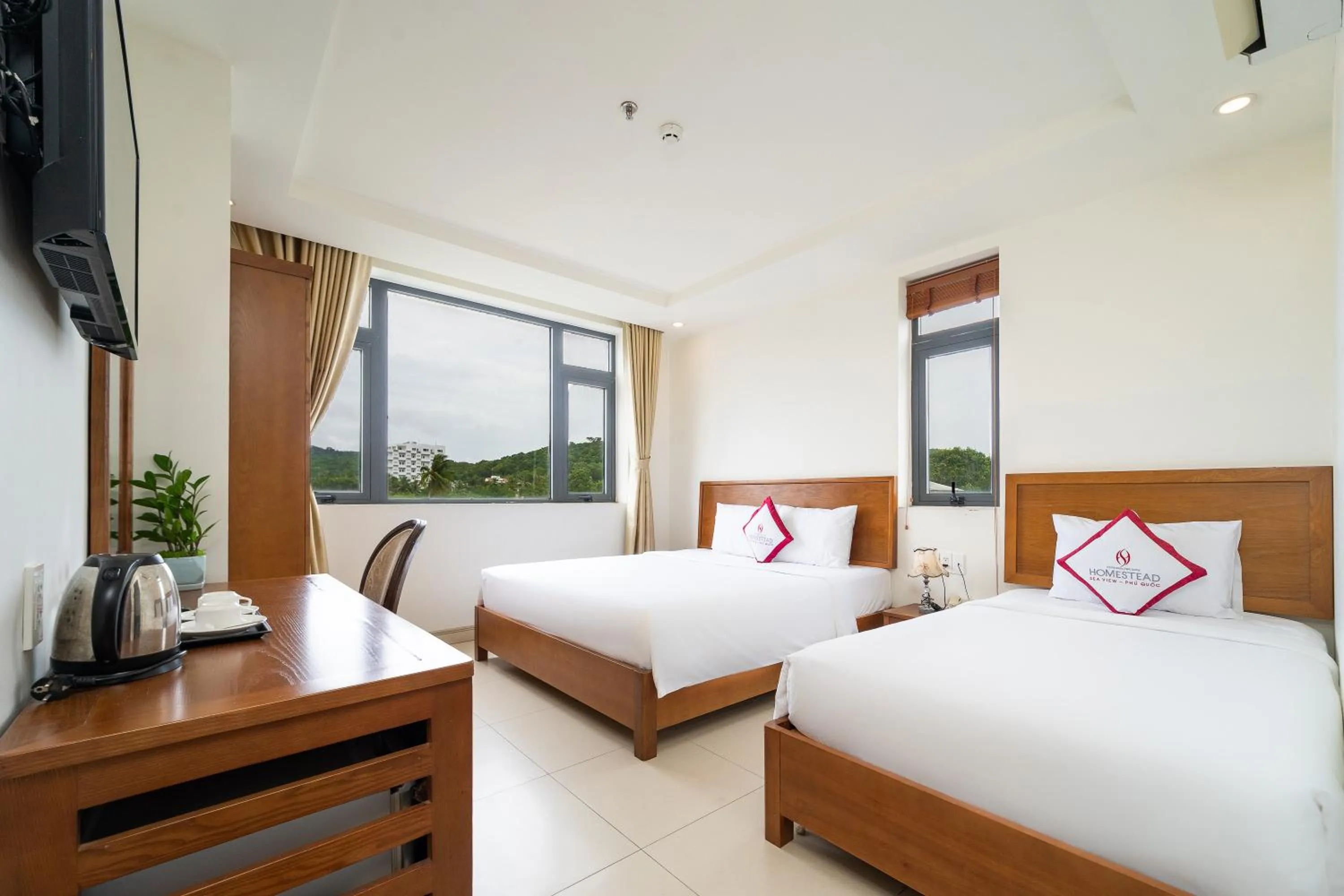 Bed in Homestead Seaview Phu Quoc Hotel