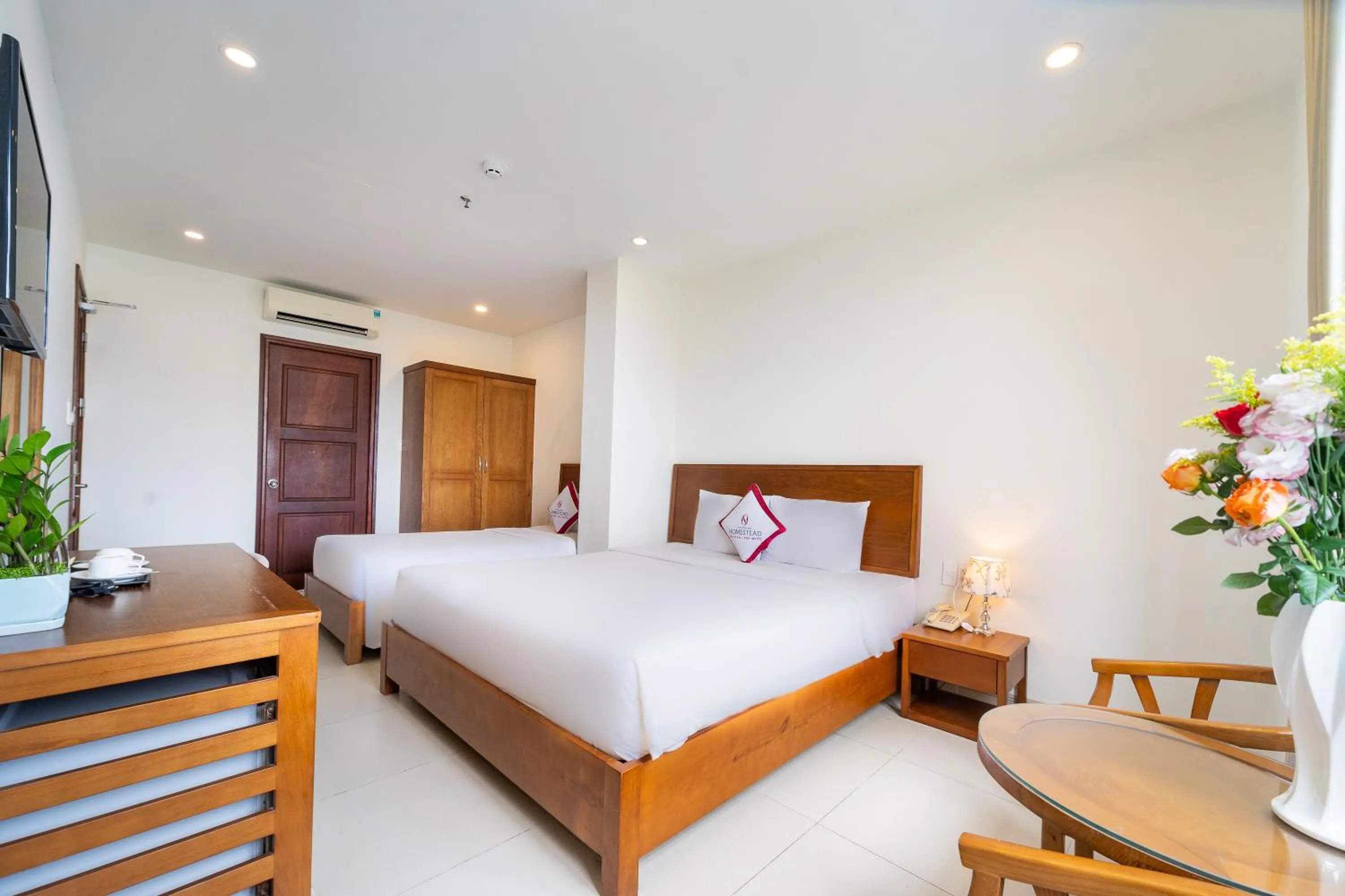 Bed in Homestead Seaview Phu Quoc Hotel