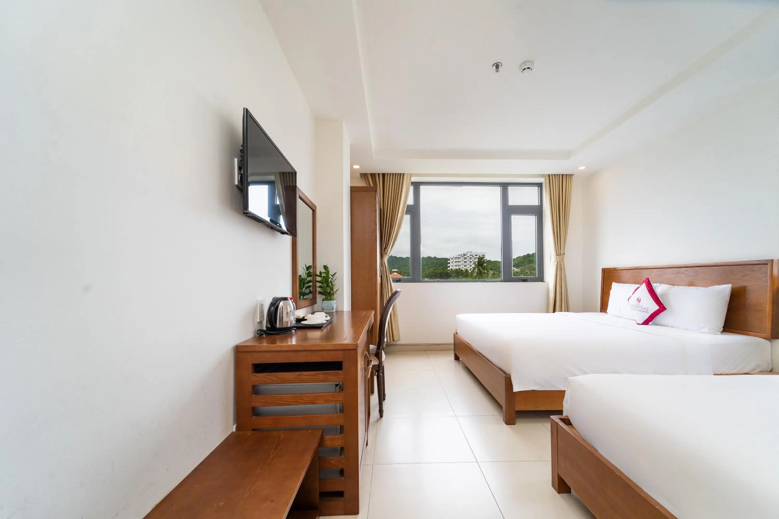 Bed in Homestead Seaview Phu Quoc Hotel