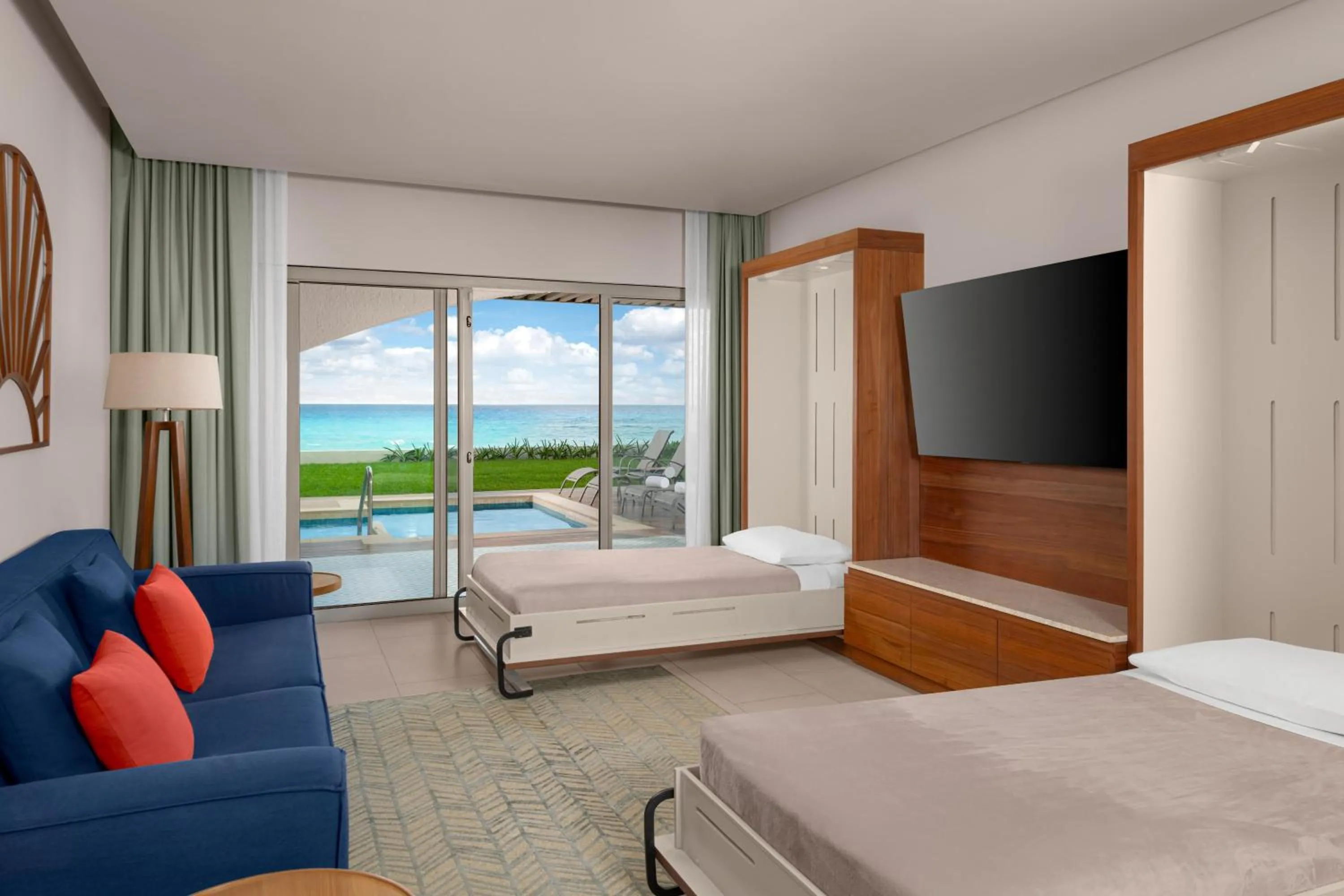 Living room, Bed in Hilton Cancun Mar Caribe All-Inclusive Resort
