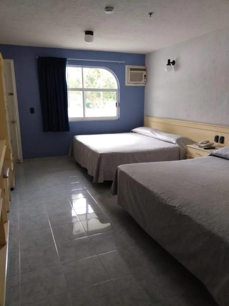 Bed in Dorados Conventions & Resort