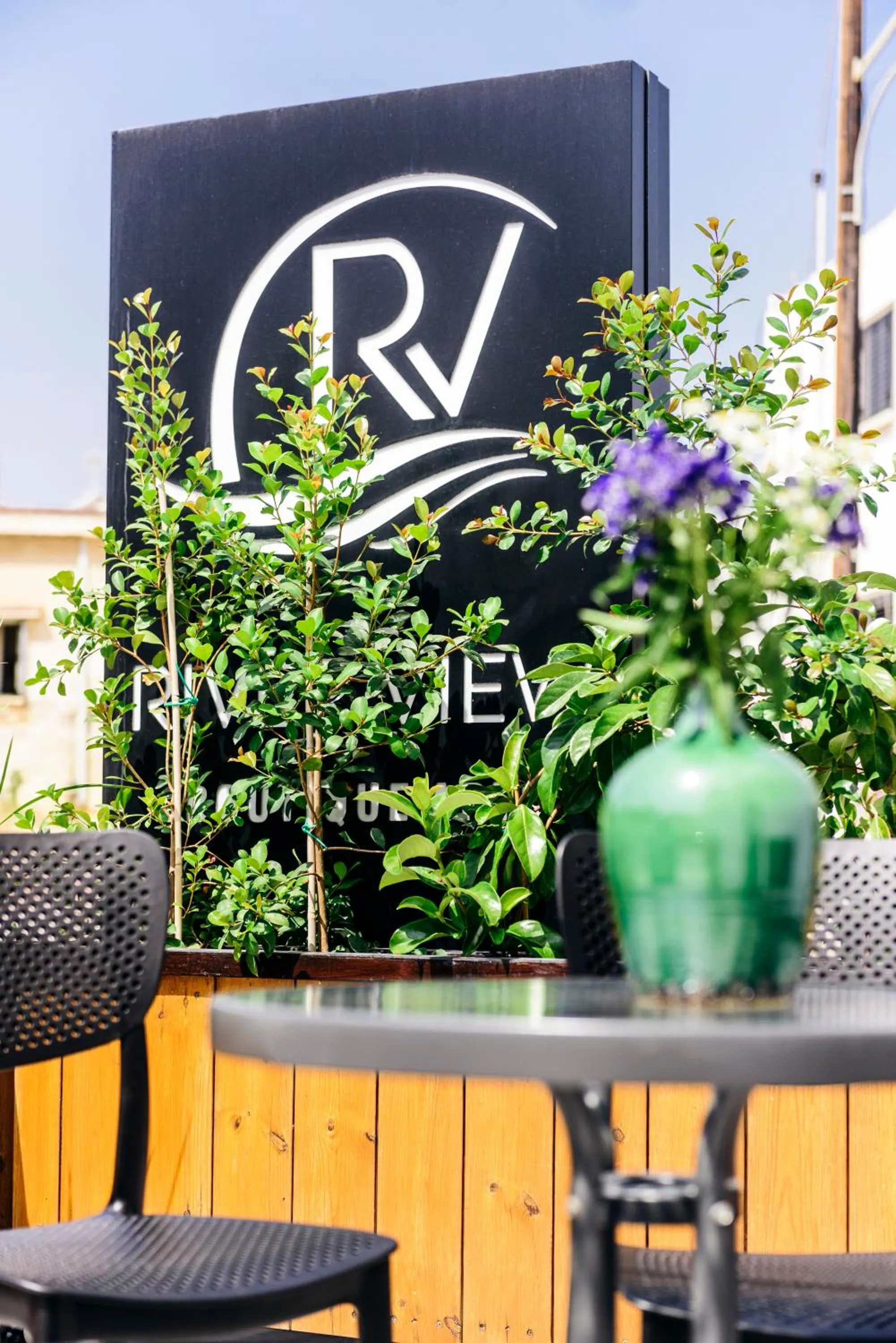 Property logo or sign in River View Boutique Apts