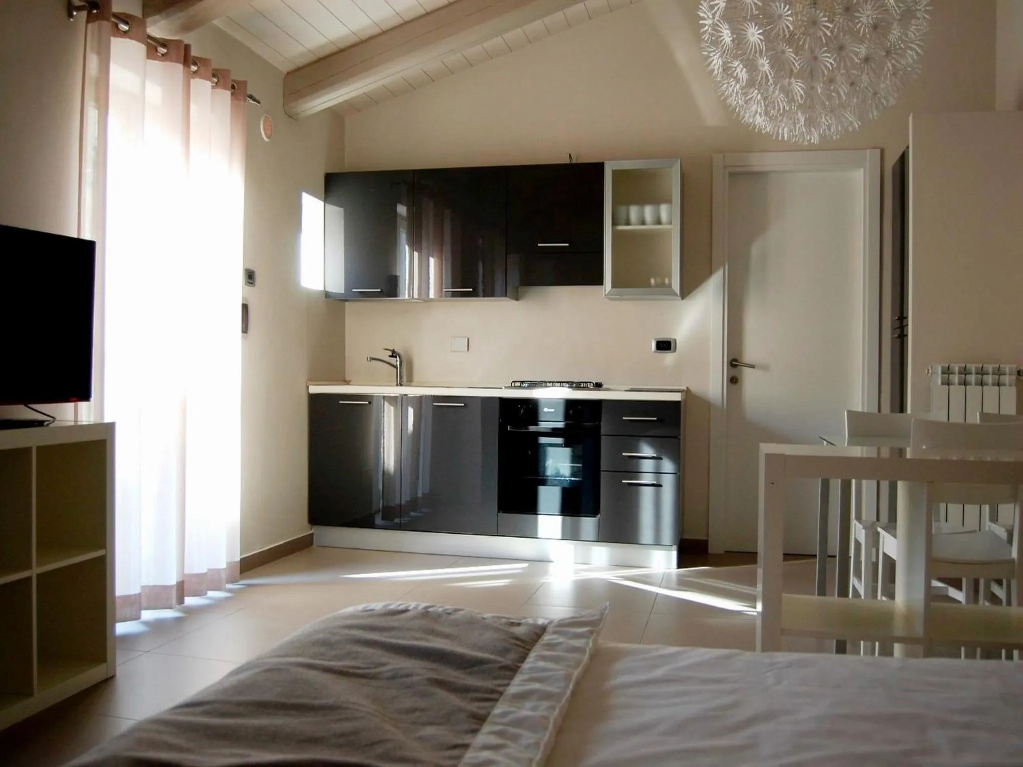 Living room, Bed in Residenza il Nespolo - Estella Hotel Collection