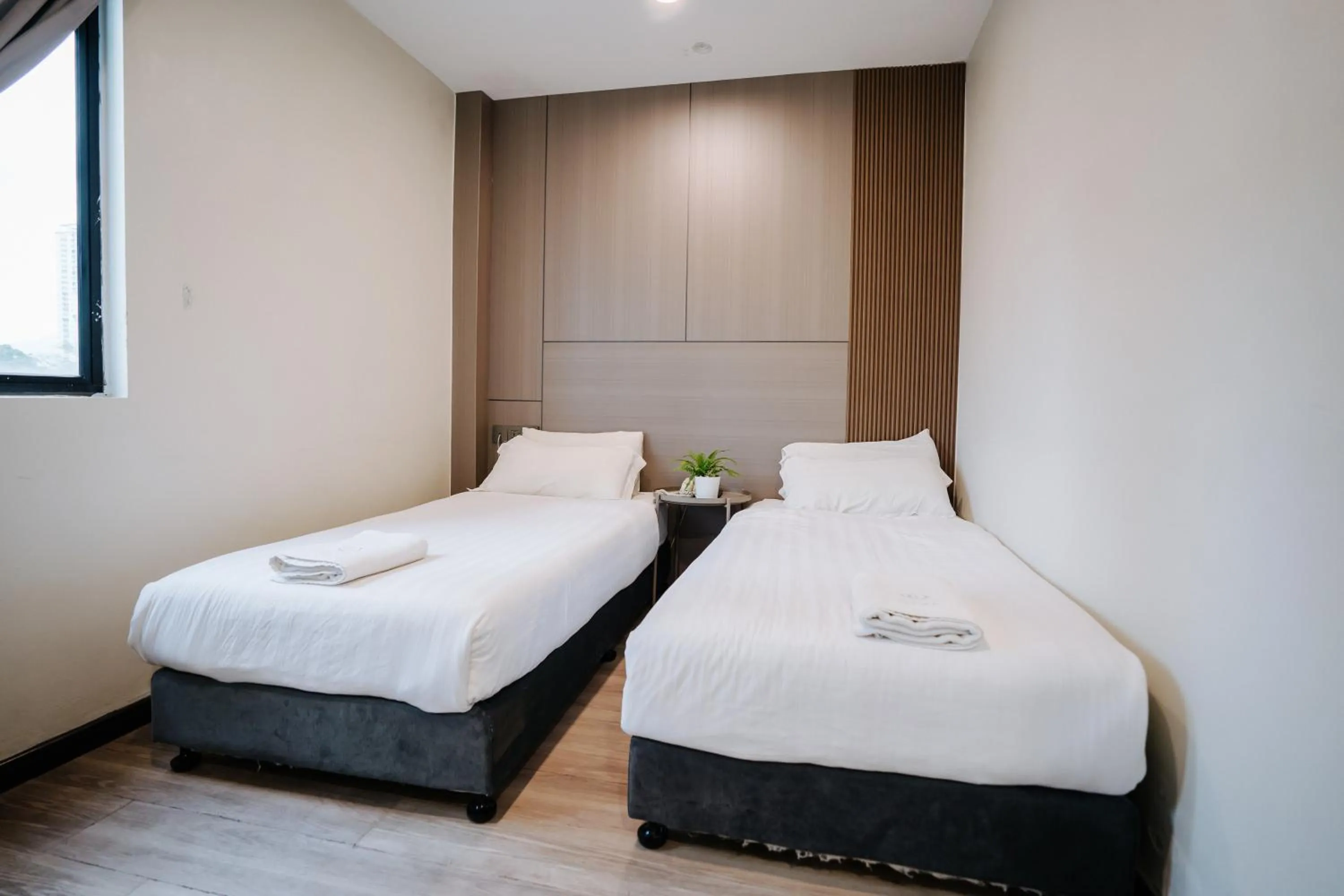 Bed in Wangs Hotel Gurney Drive