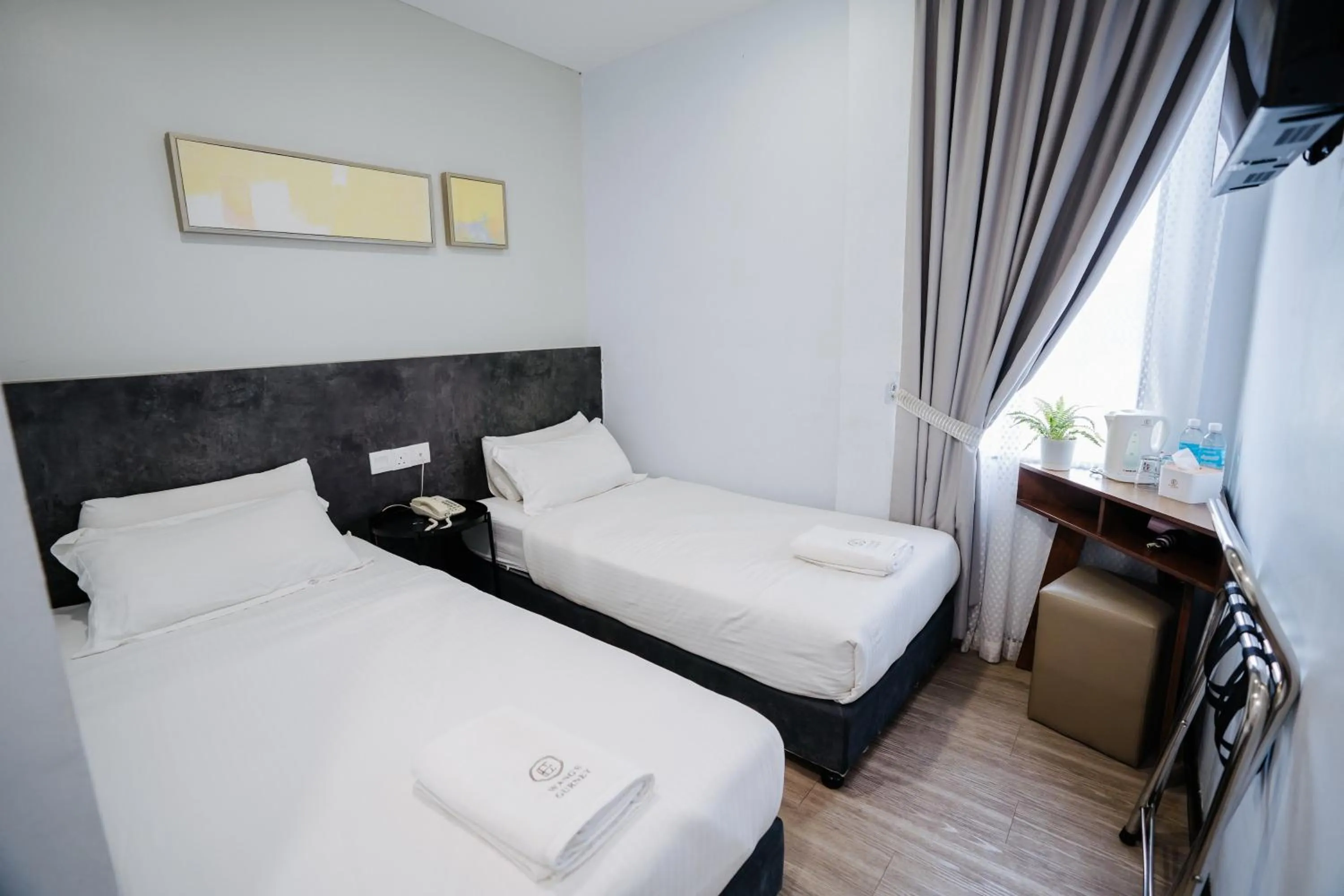 Bed in Wangs Hotel Gurney Drive