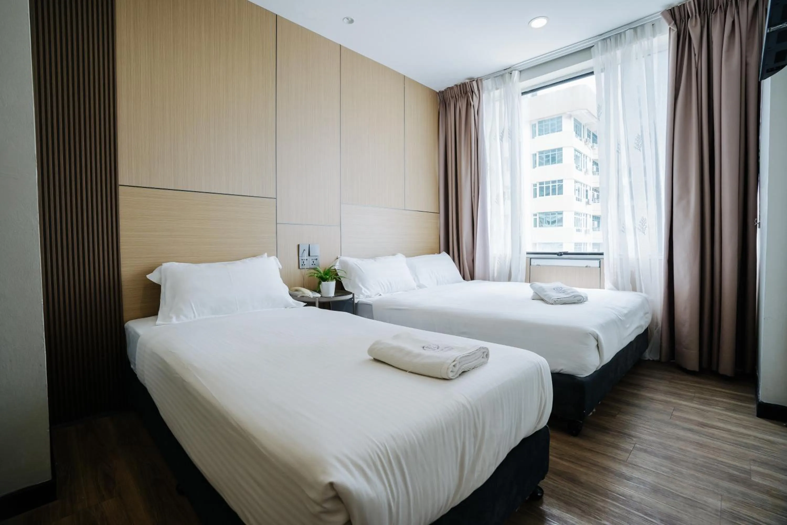 Bed in Wangs Hotel Gurney Drive