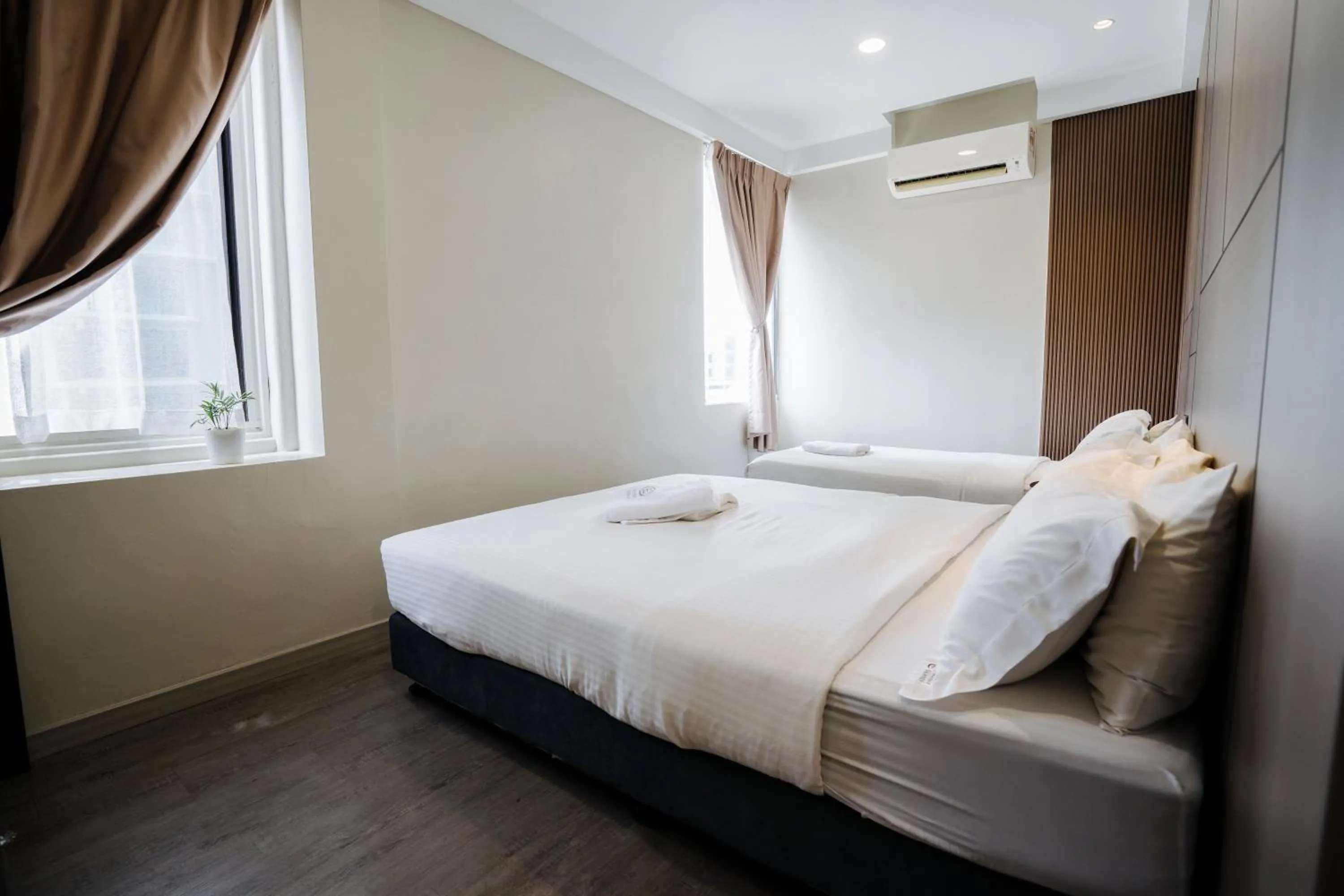 Bed in Wangs Hotel Gurney Drive