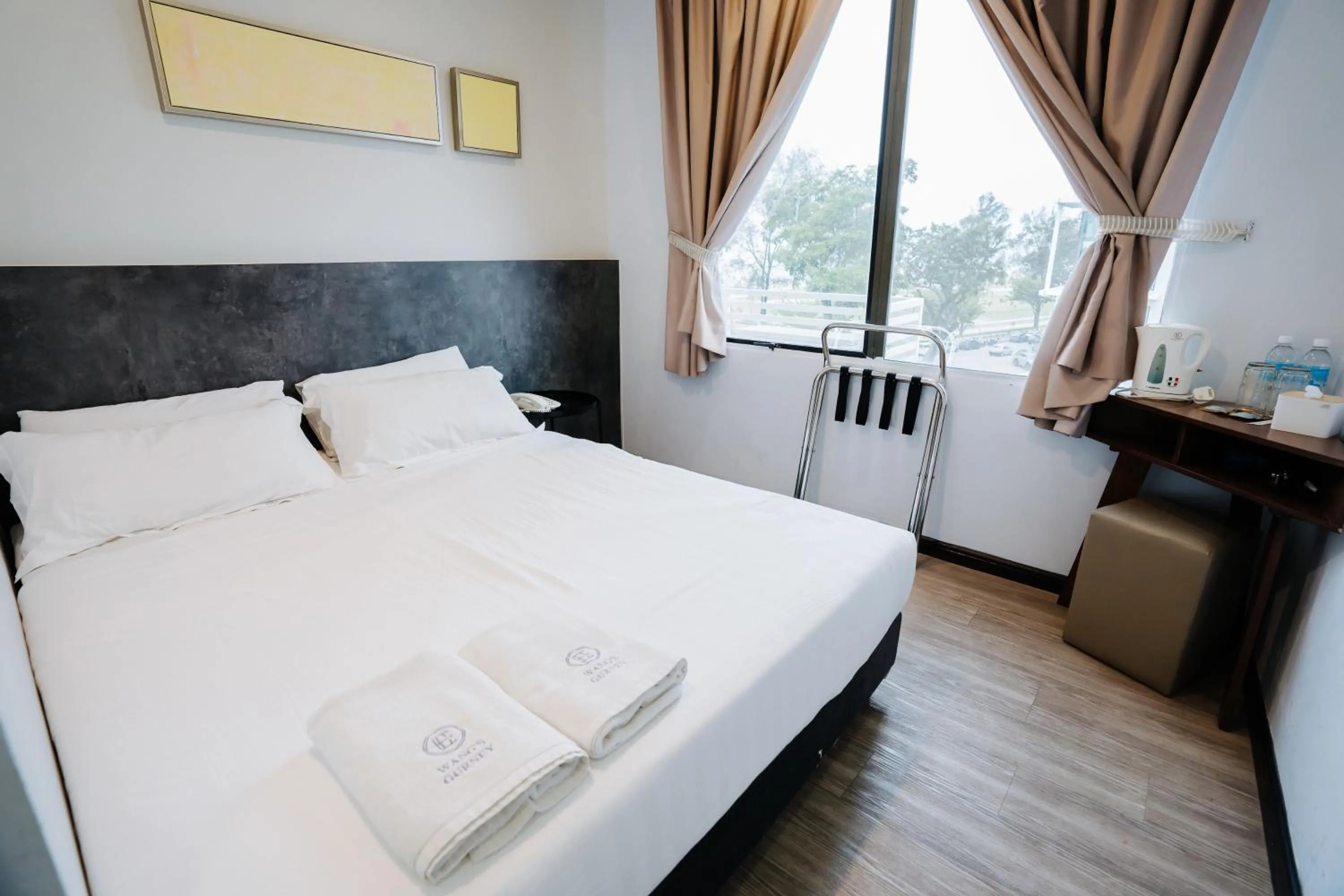 Bed in Wangs Hotel Gurney Drive