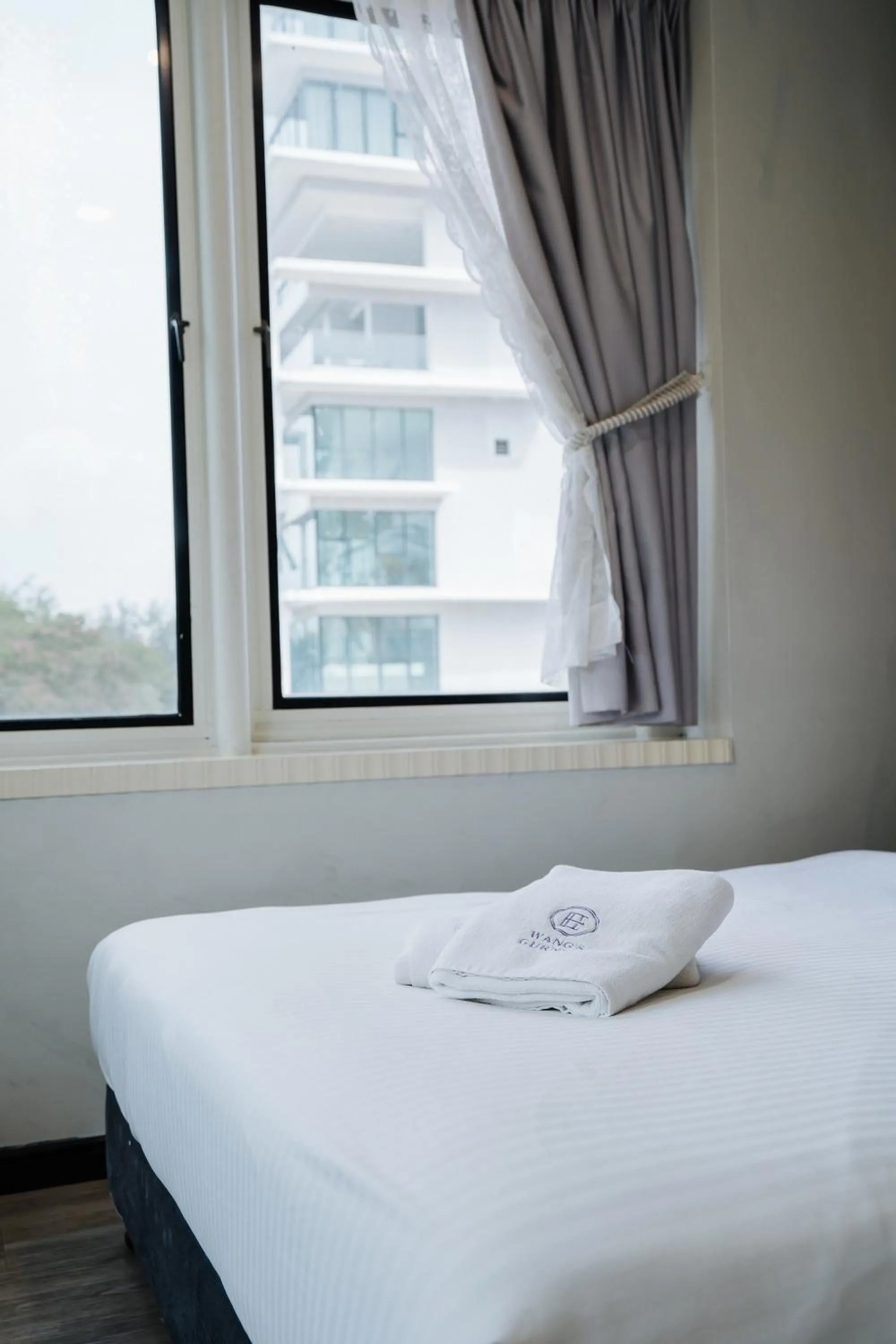 Bed in Wangs Hotel Gurney Drive