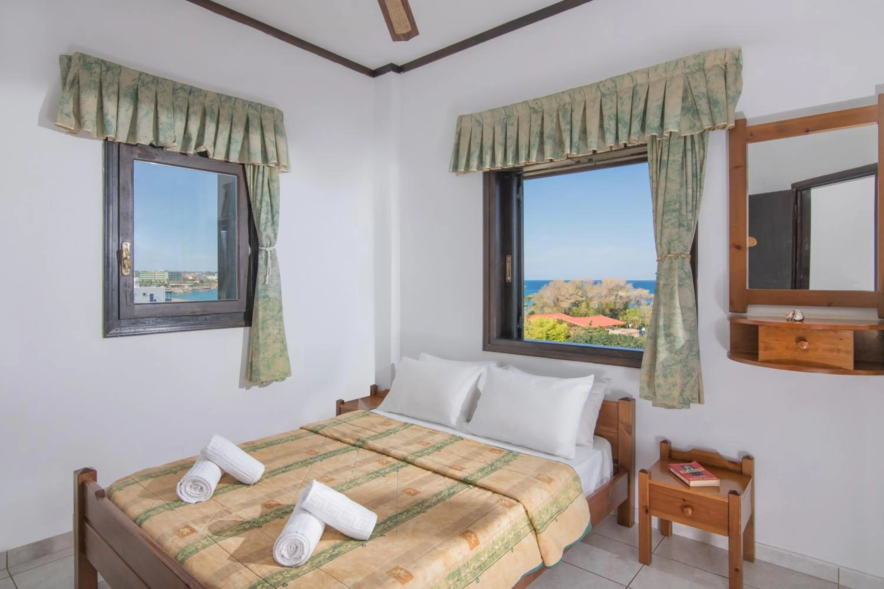 Bed in Iliostasi Beach Apartments