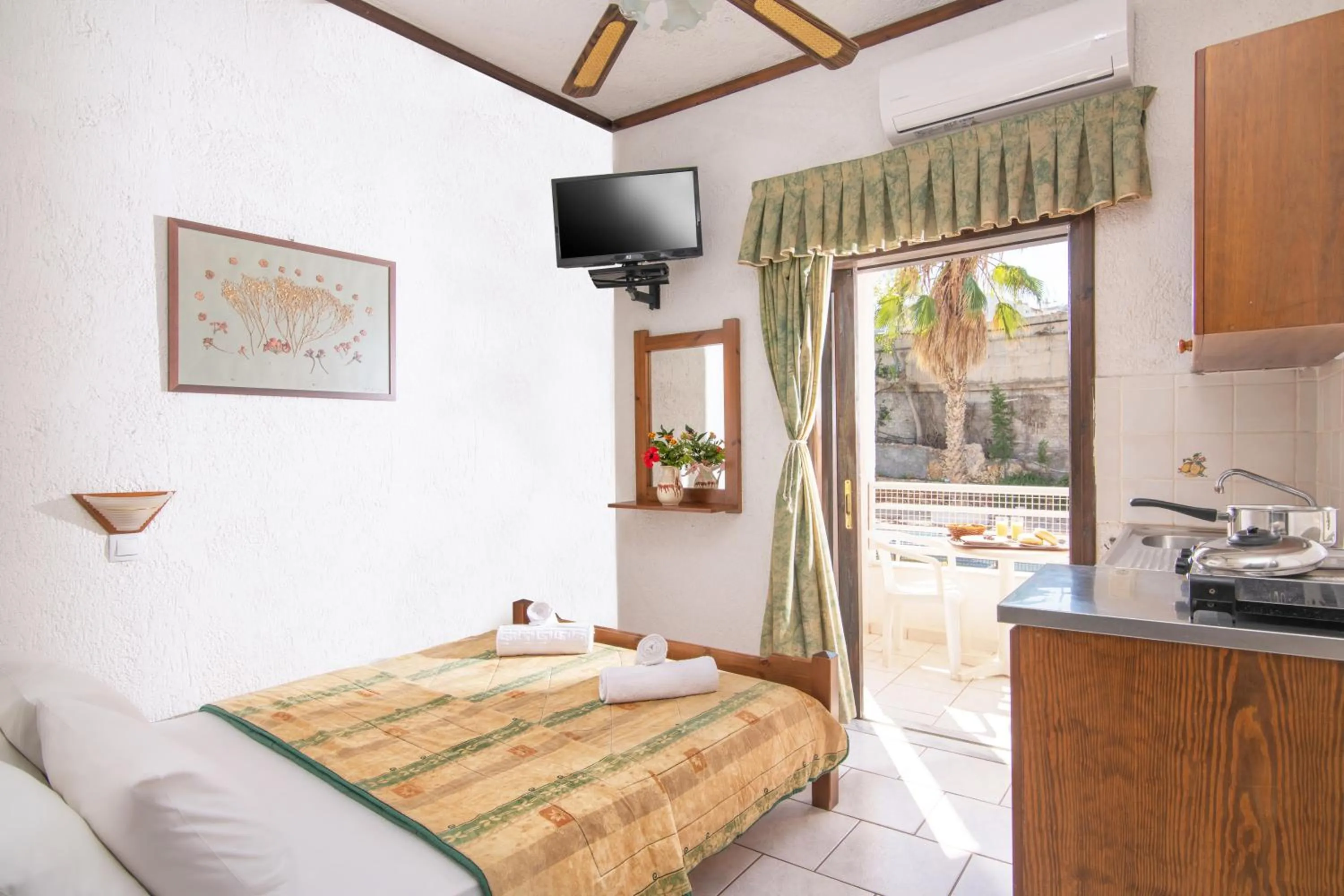 Bed in Iliostasi Beach Apartments