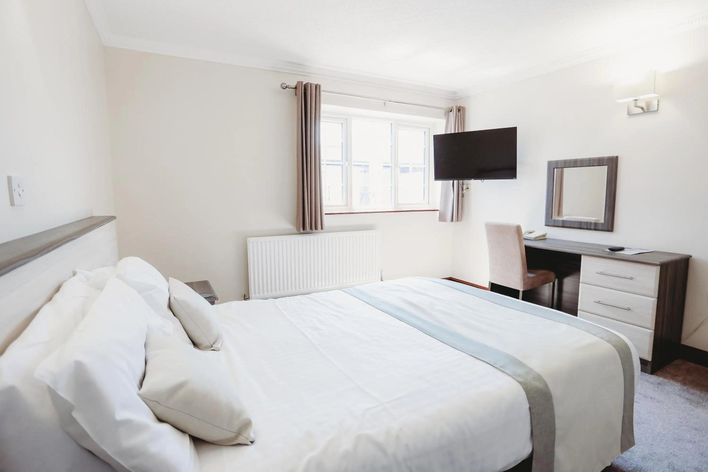 Bed in The Appleby Inn Hotel