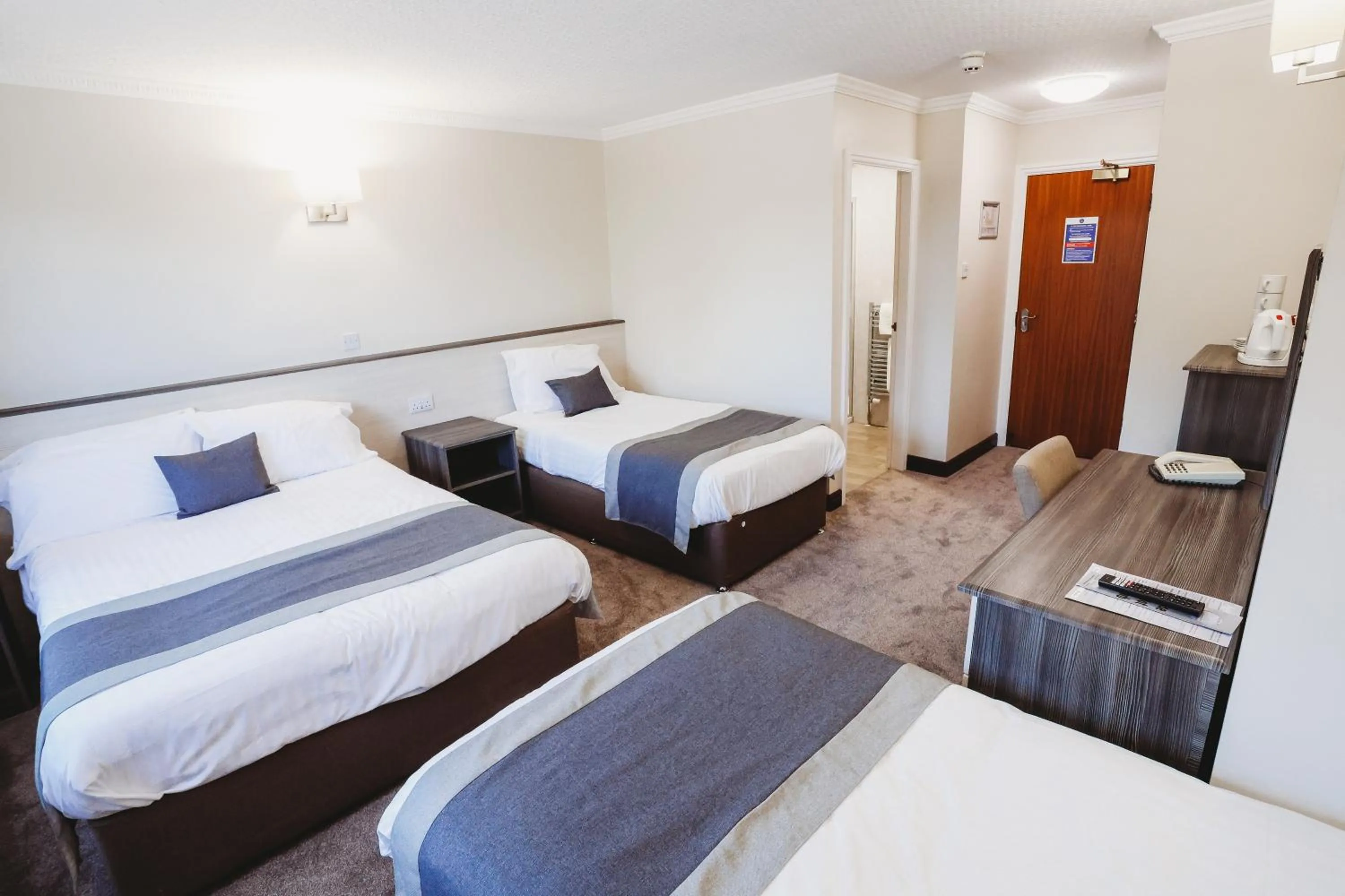 Bed in The Appleby Inn Hotel