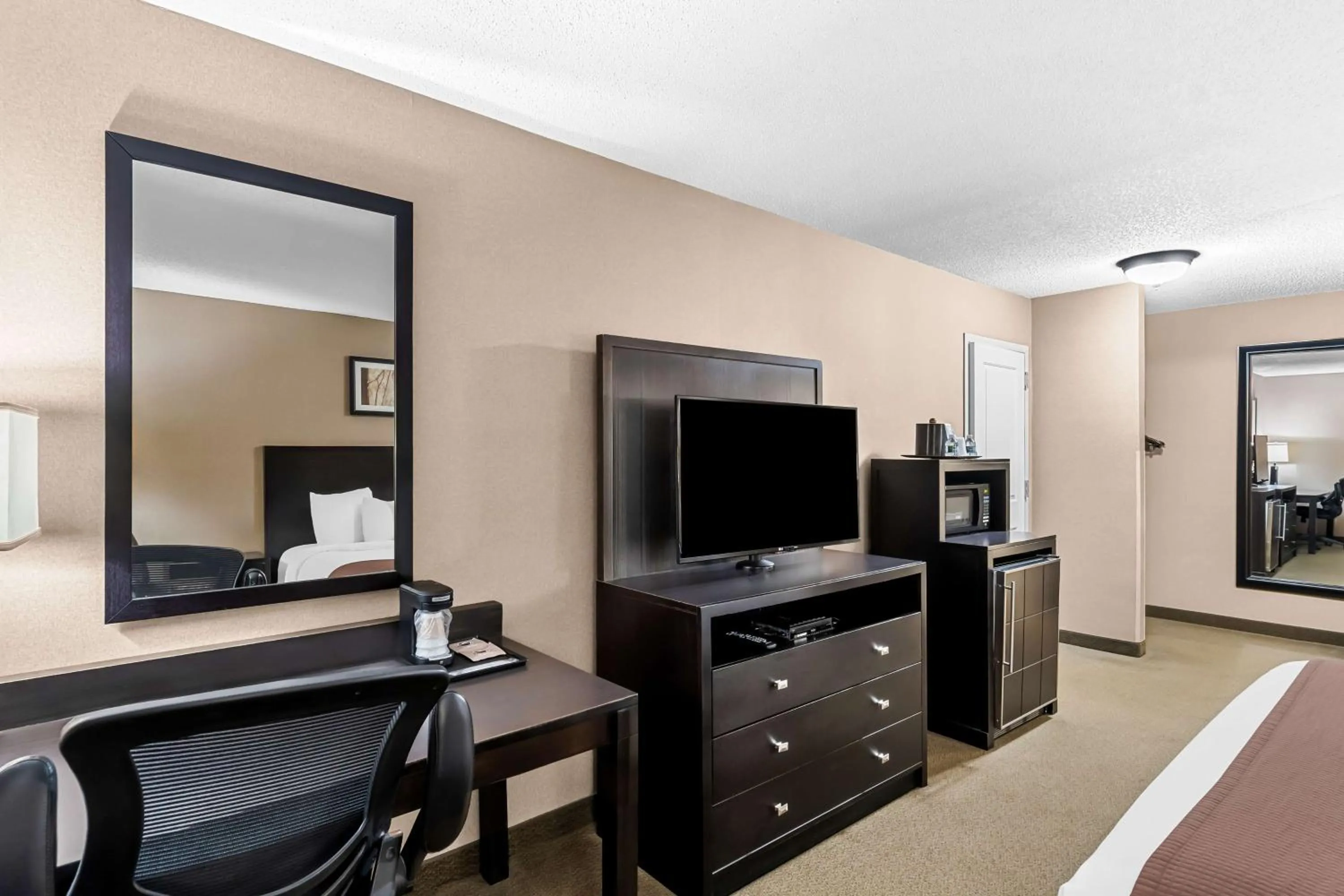 Bedroom in Heartland Inn & Suites, SureStay Collection by Best Western