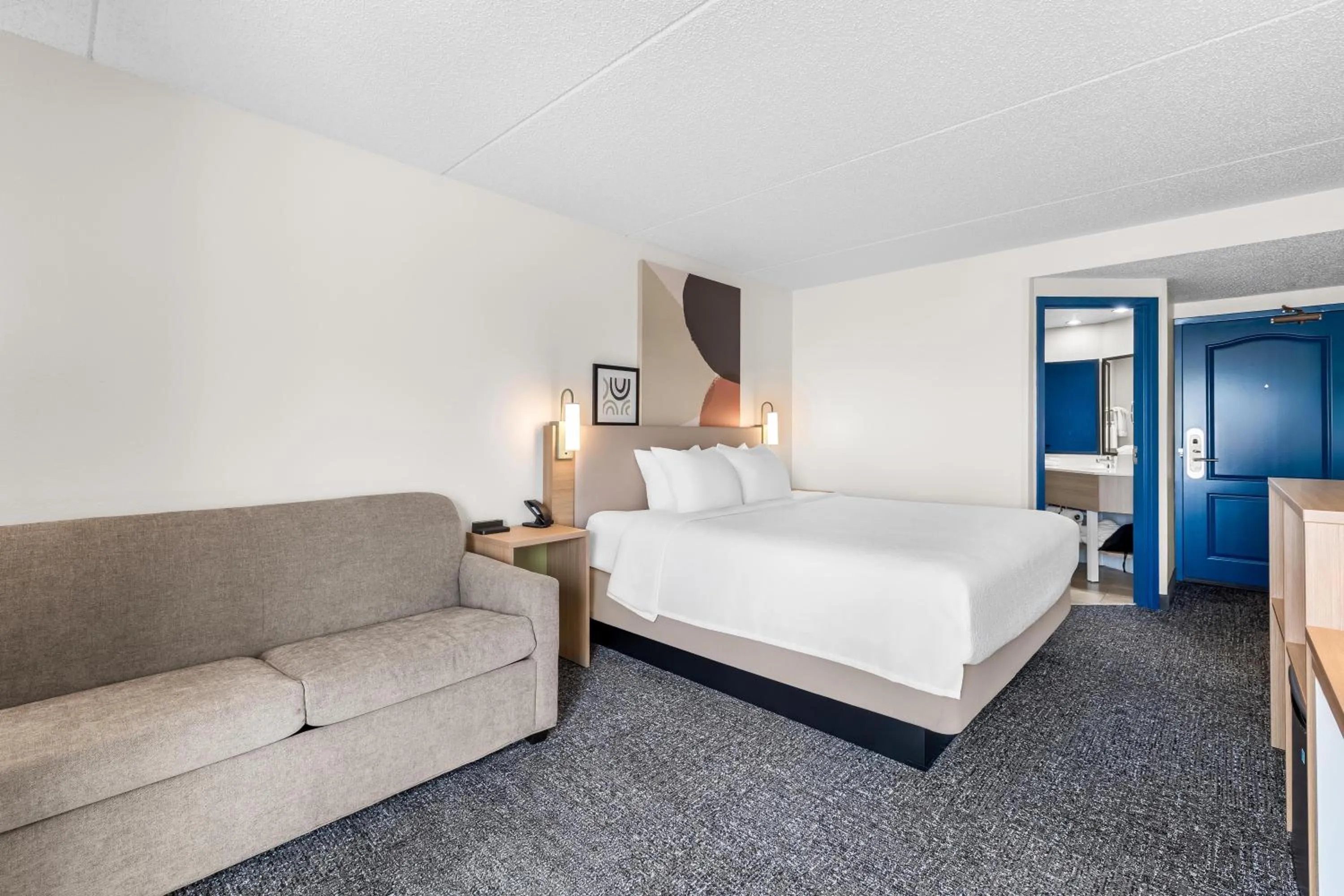 Living room, Bed in Spark by Hilton Green Bay