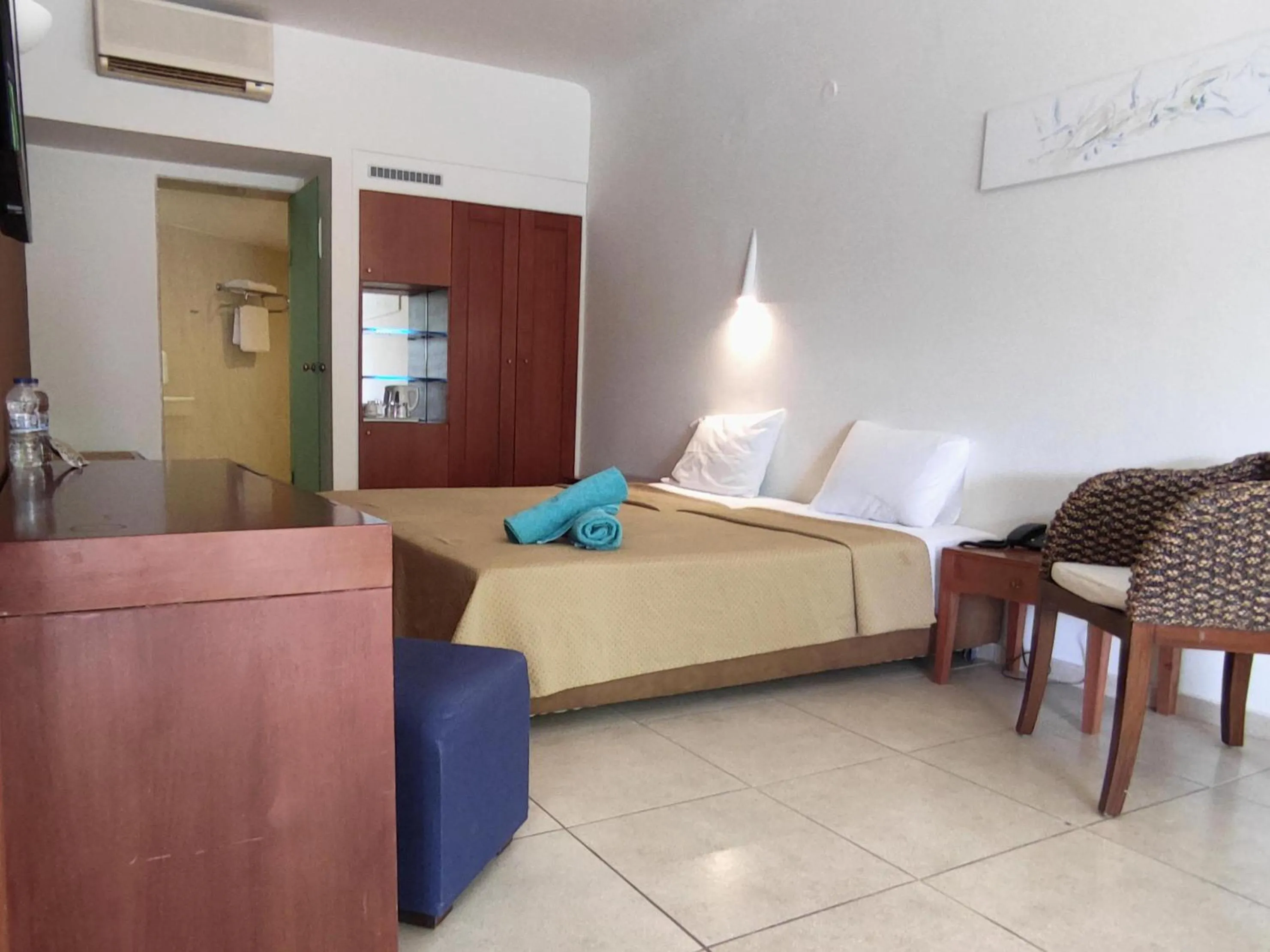 Bed in Apollonia Beach Resort & Spa