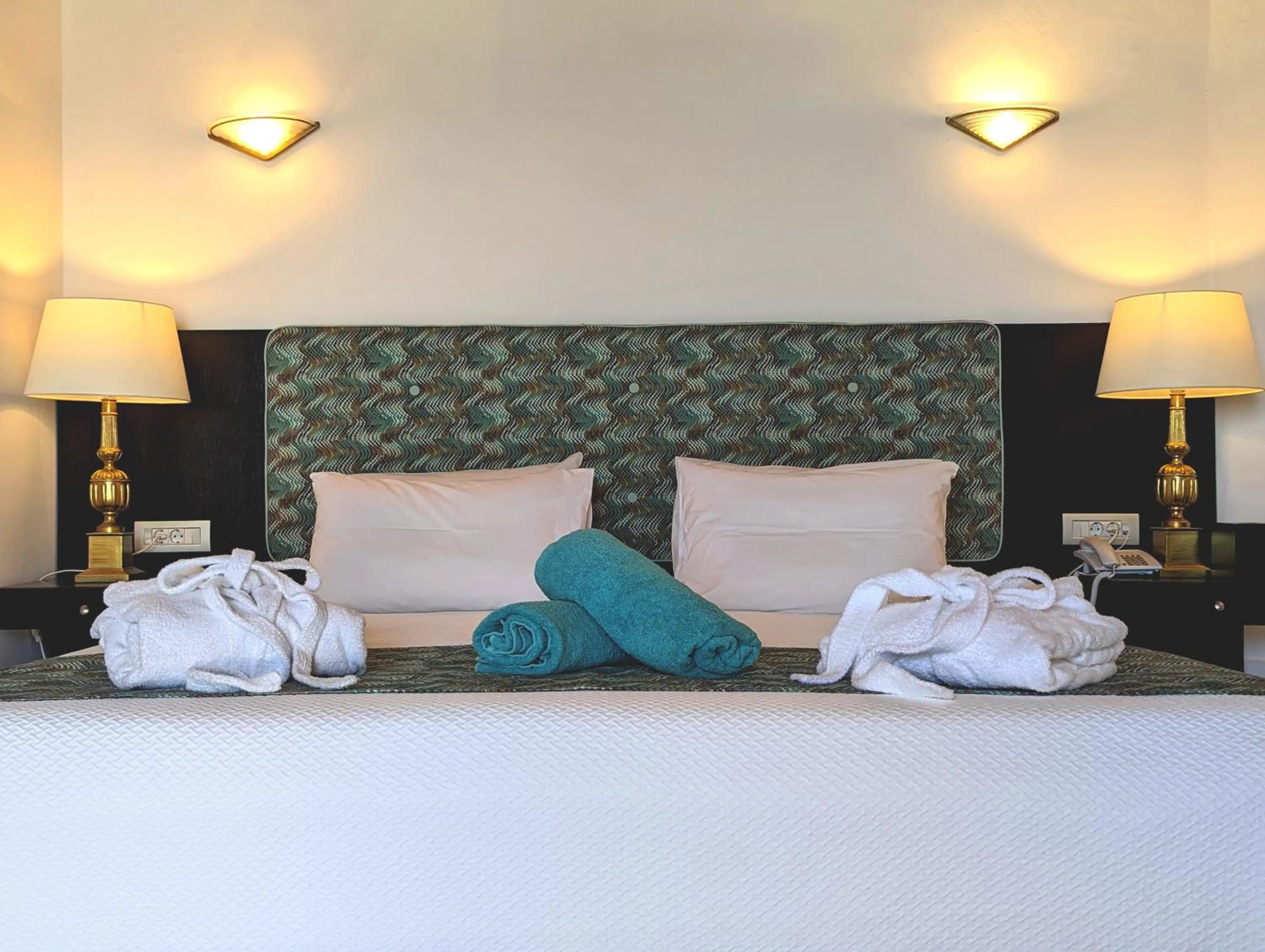 Bed in Apollonia Beach Resort & Spa