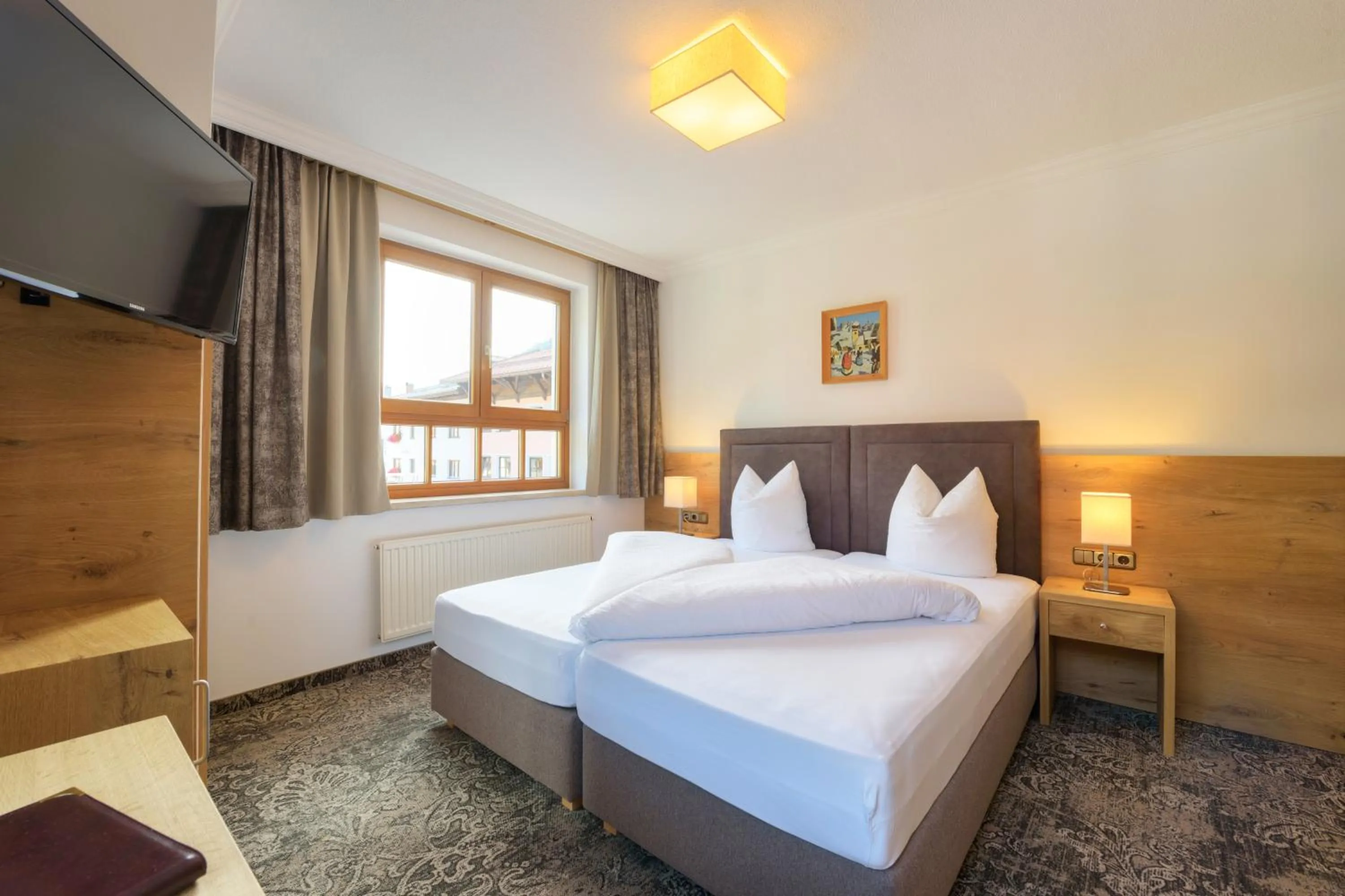 Bed in Aparthotel Acksteiner