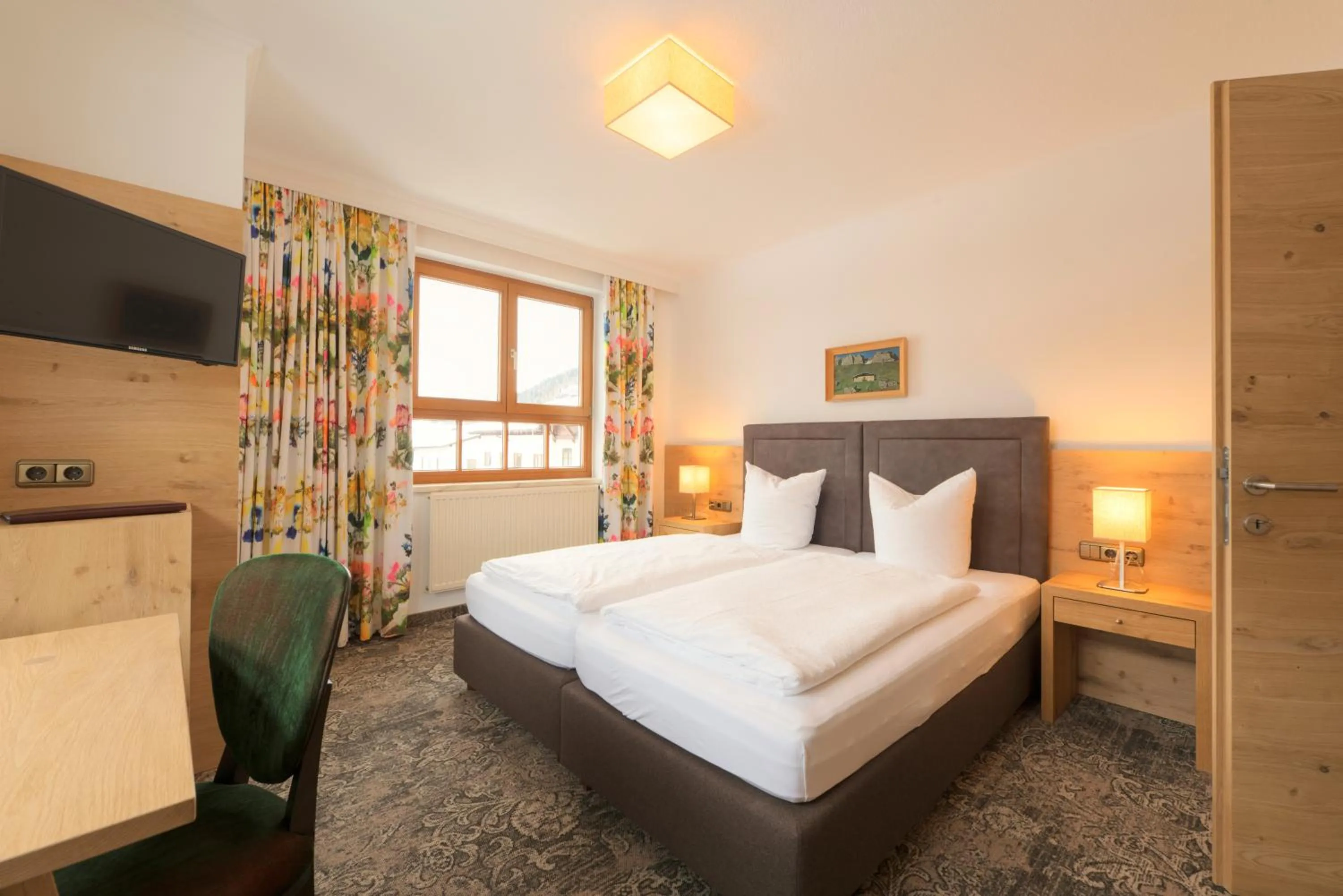 Bed in Aparthotel Acksteiner