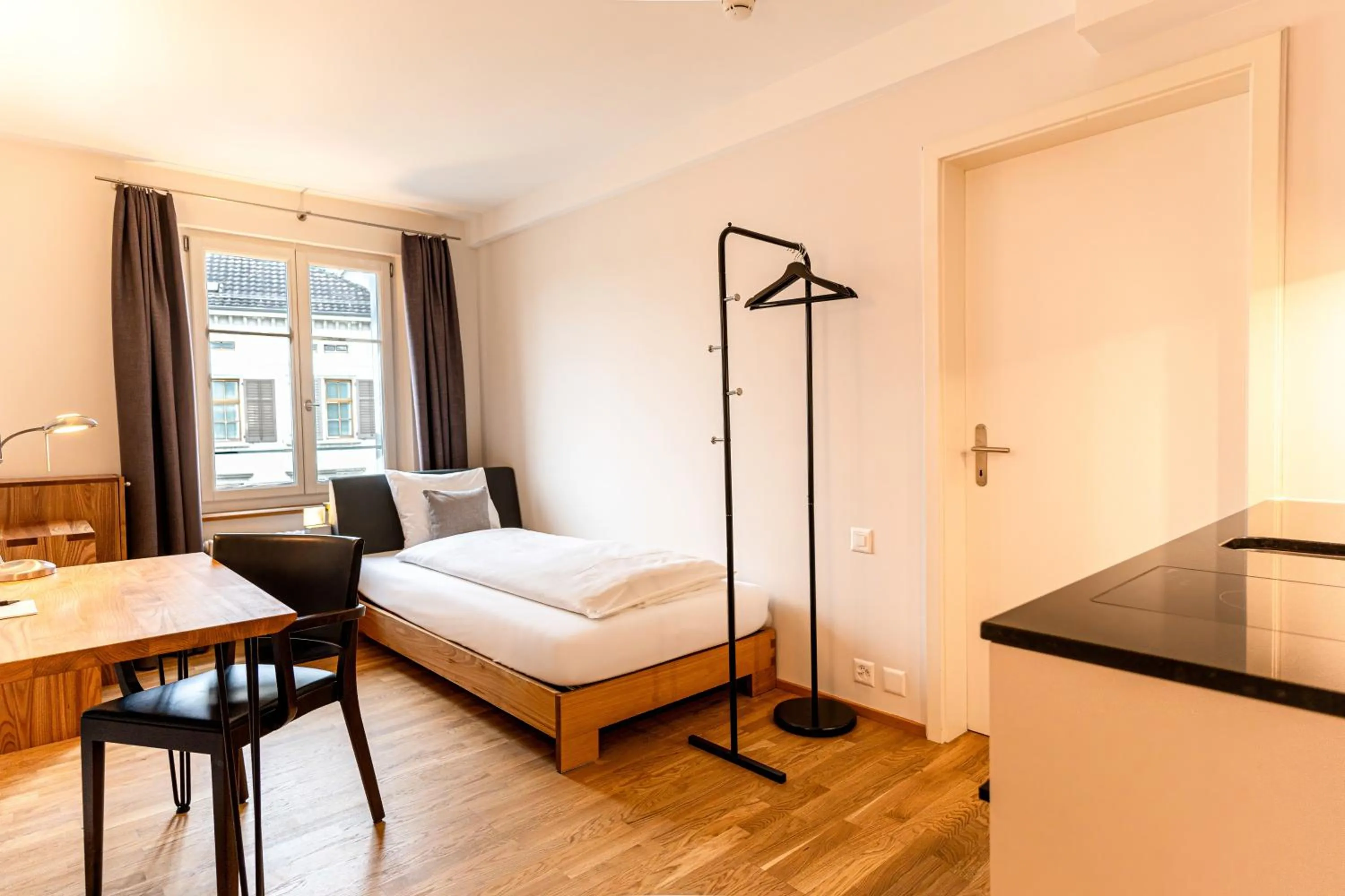 Bed in Hotel Le Lion - Self Check-in