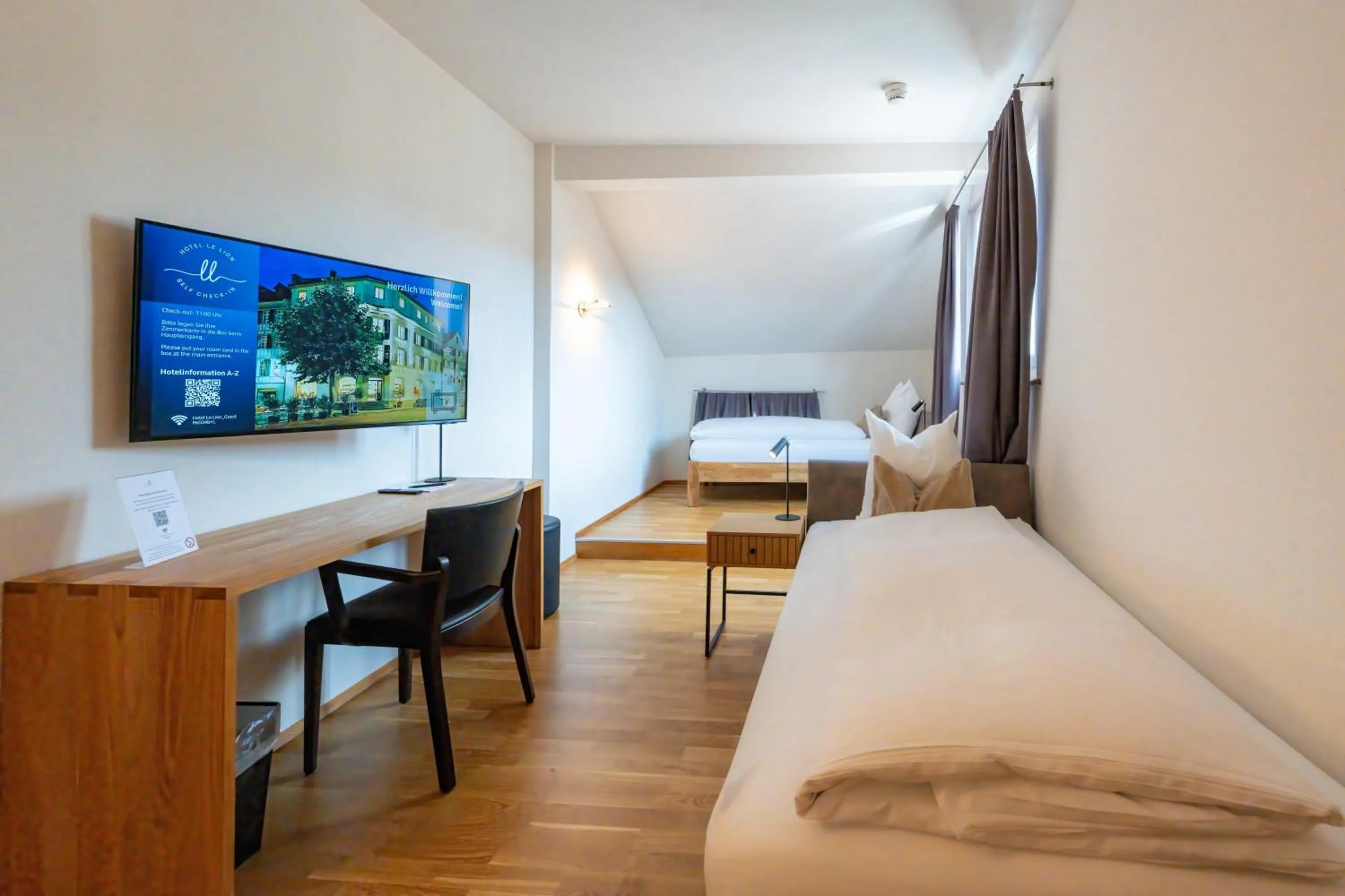 Bed in Hotel Le Lion - Self Check-in