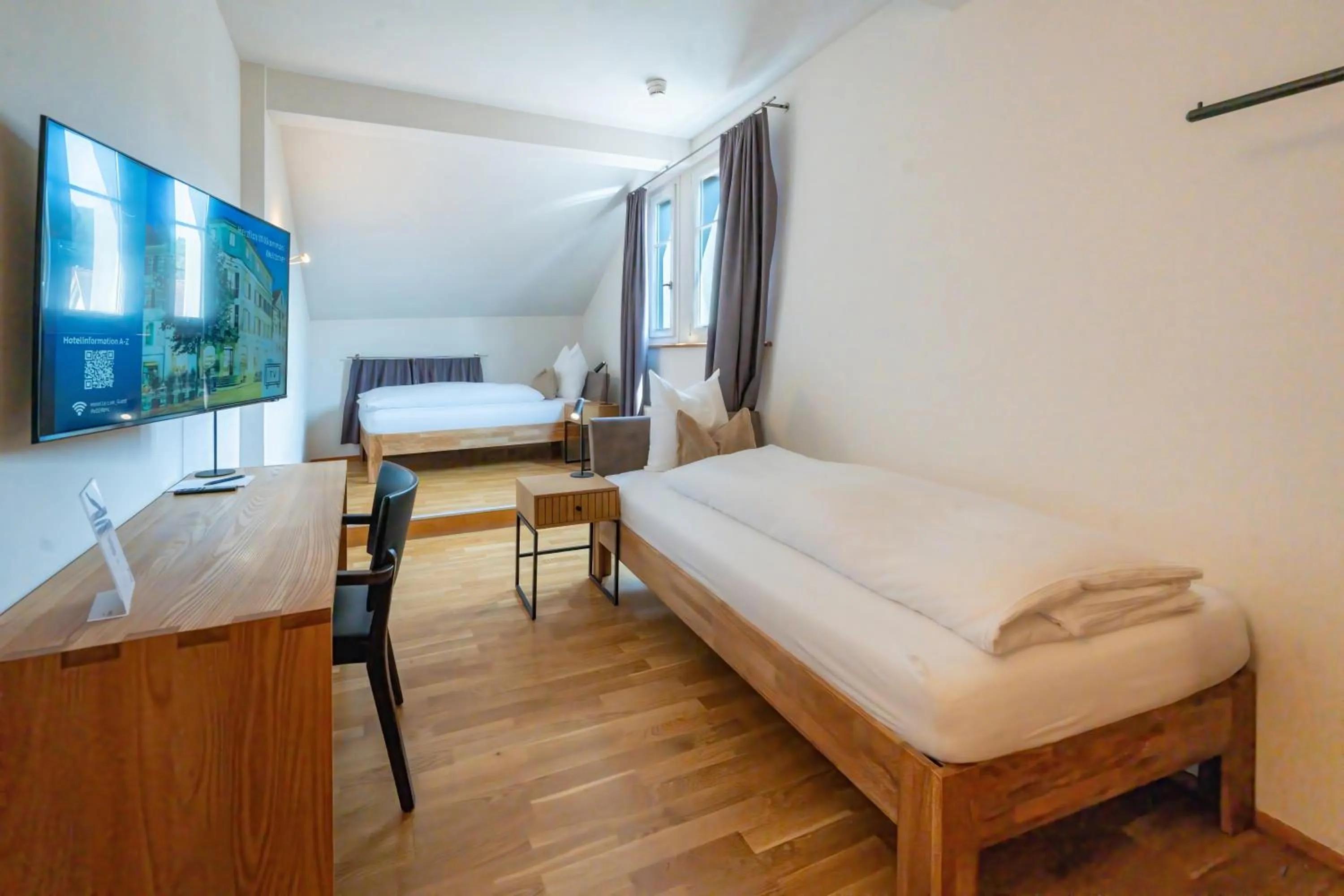 Bed in Hotel Le Lion - Self Check-in