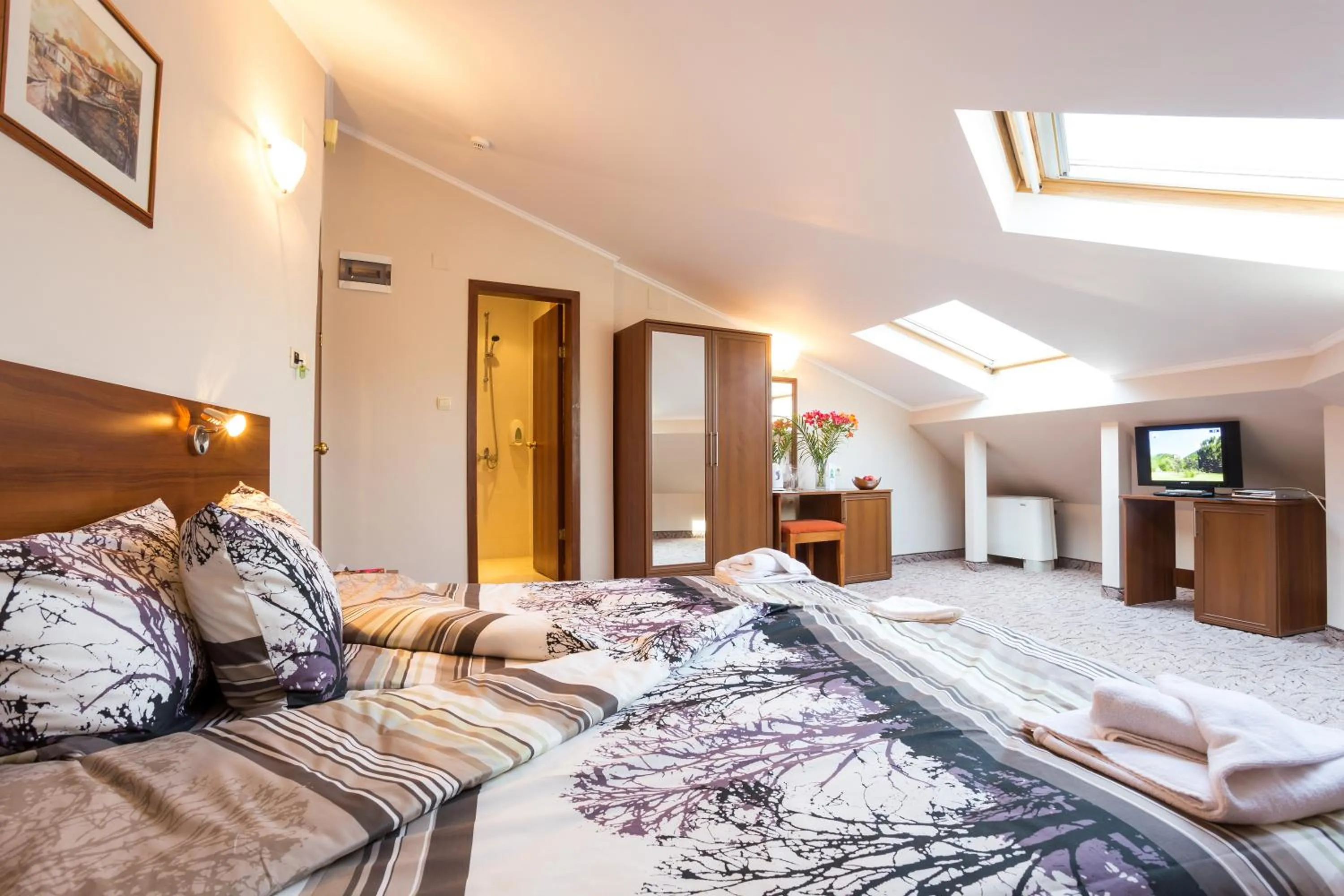 Bed in Family Hotel Romantika