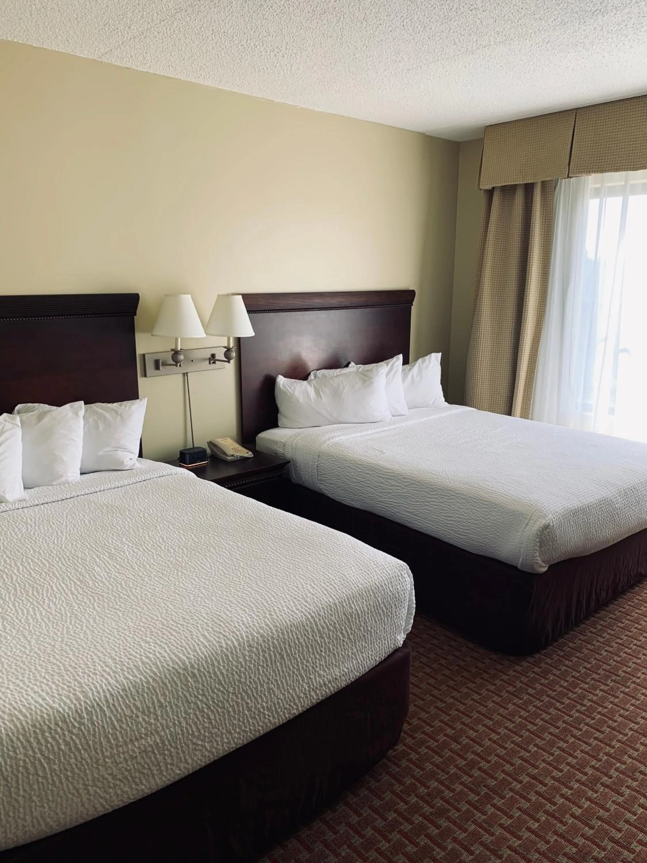 Bed in Euro-Suites Hotel