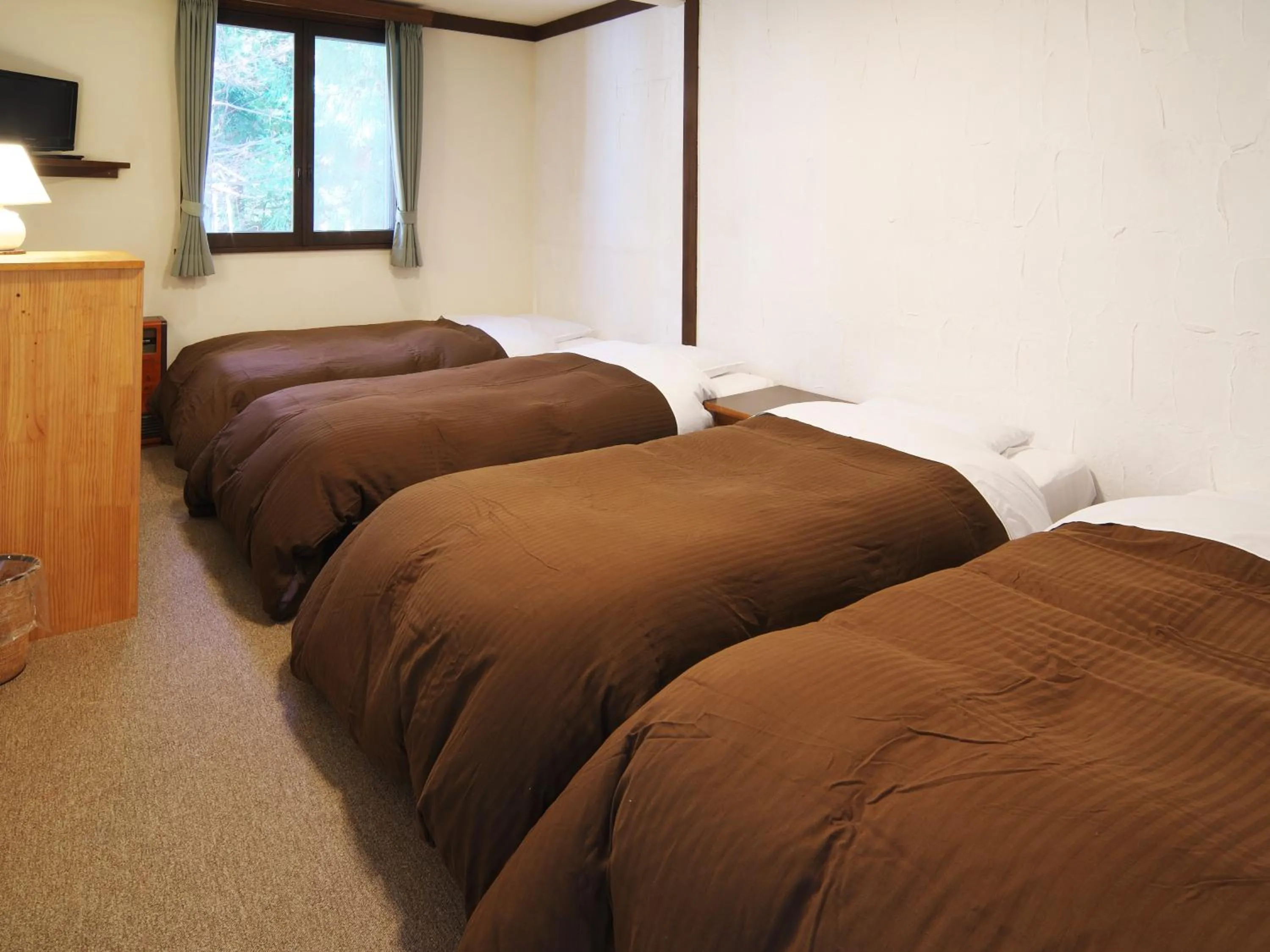 Bed in Hakuba Goryu Pension Kurumi