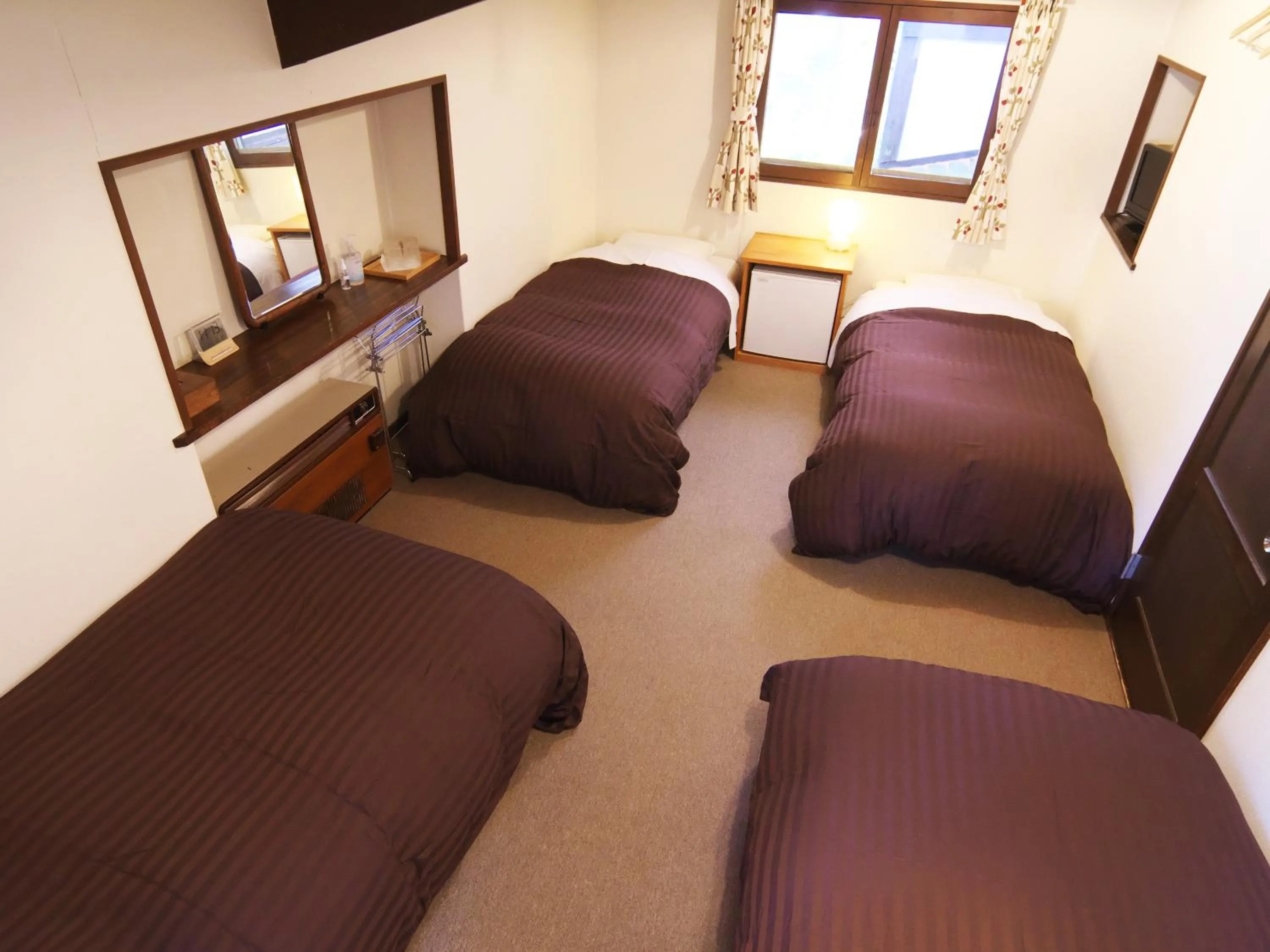 Bed in Hakuba Goryu Pension Kurumi