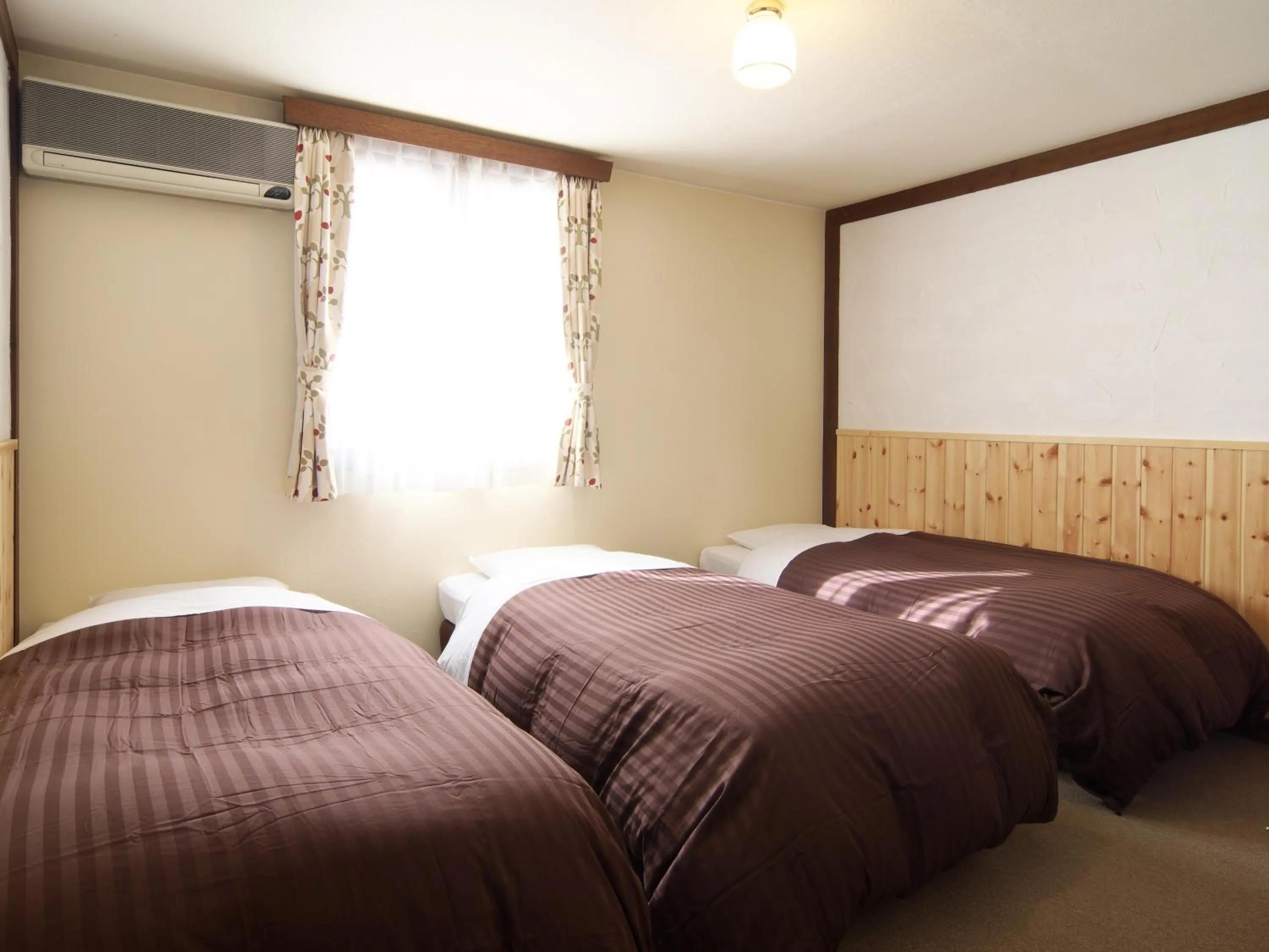 Bed in Hakuba Goryu Pension Kurumi