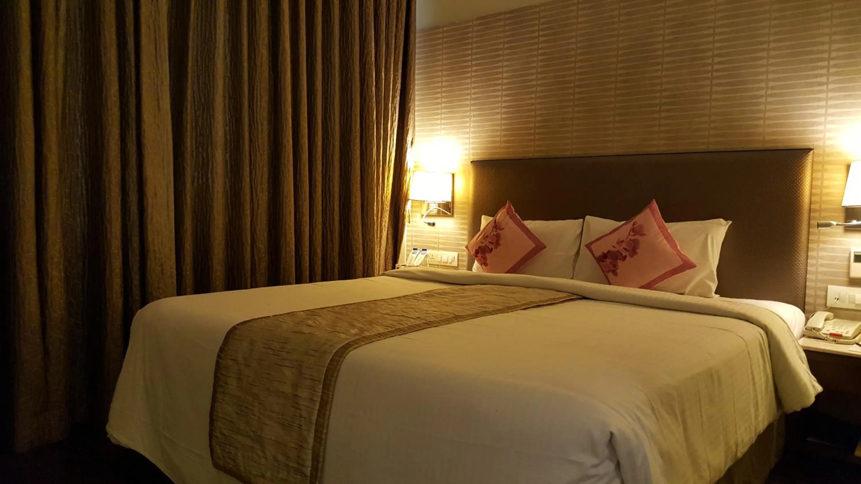 Bedroom, Bed in Royal Orchid Central Vadodara