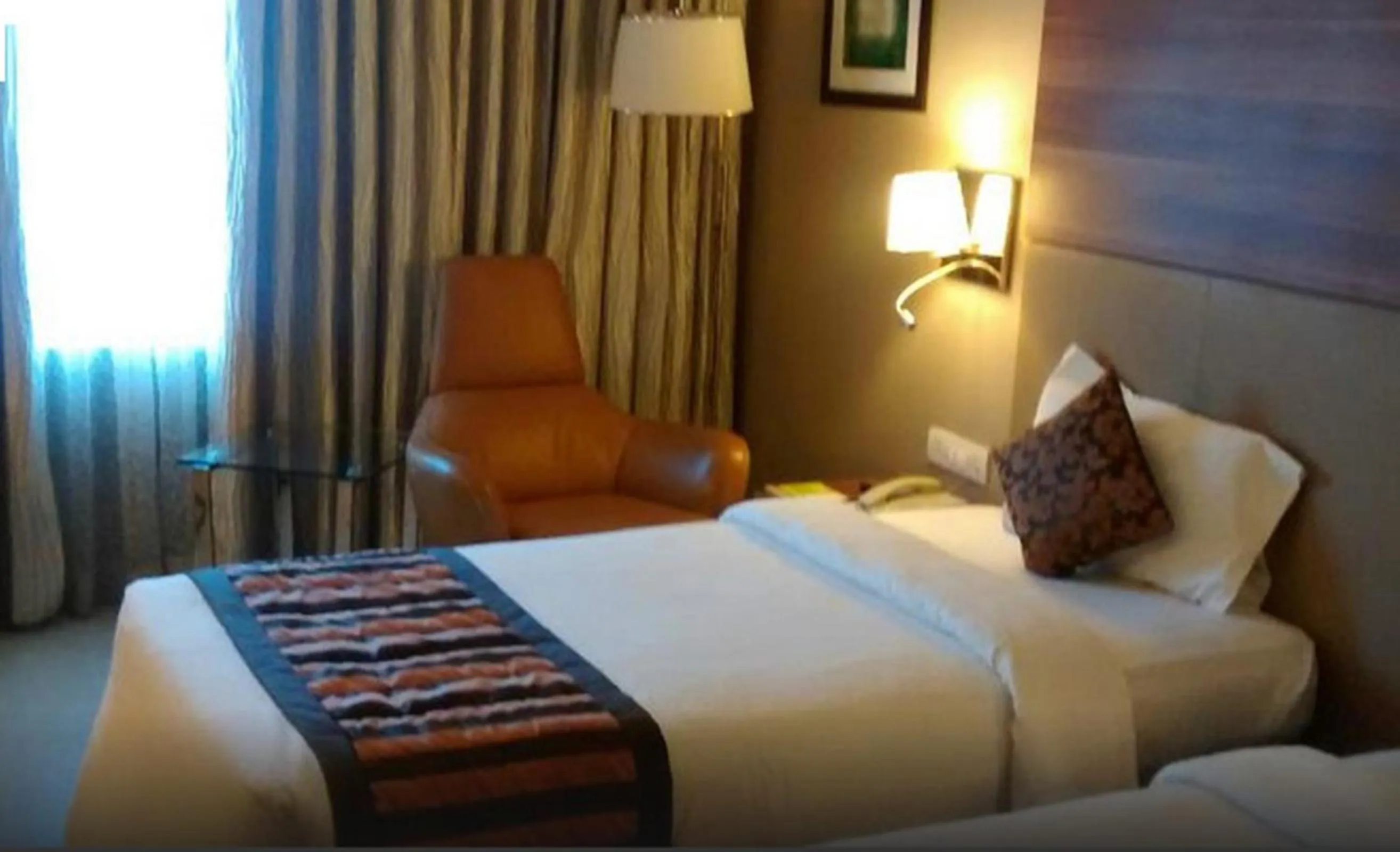 Bedroom, Bed in Royal Orchid Central Vadodara