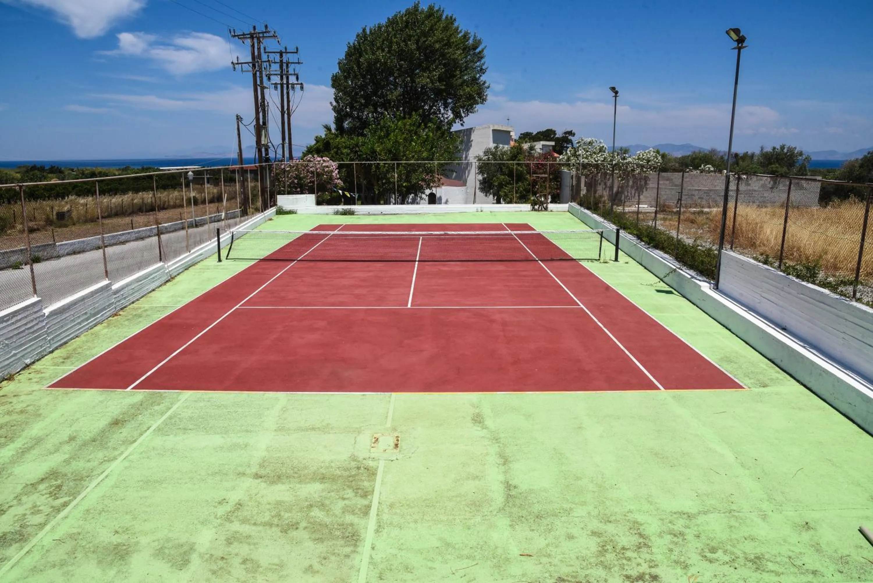 Tennis court in Vallian Village Hotel