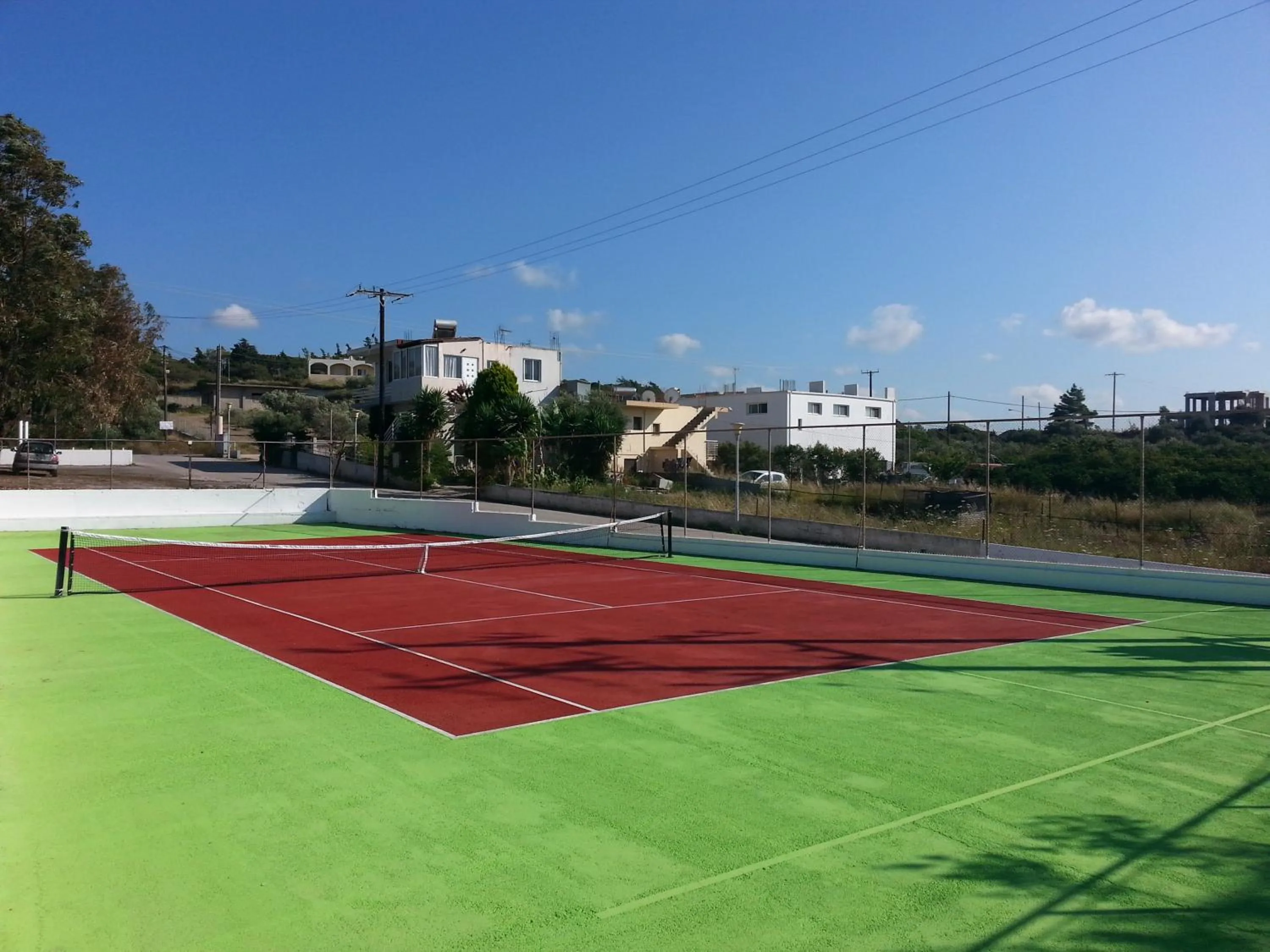 Tennis court in Vallian Village Hotel