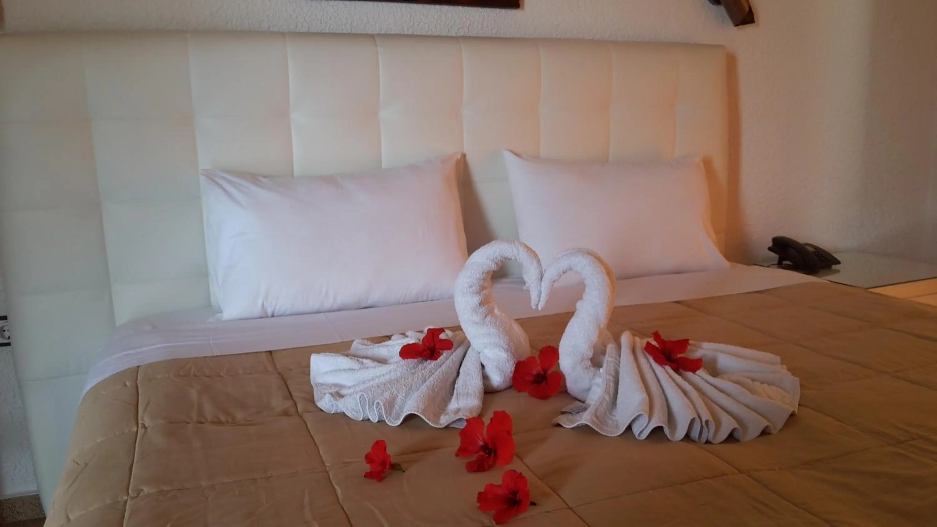 Bed in Vallian Village Hotel