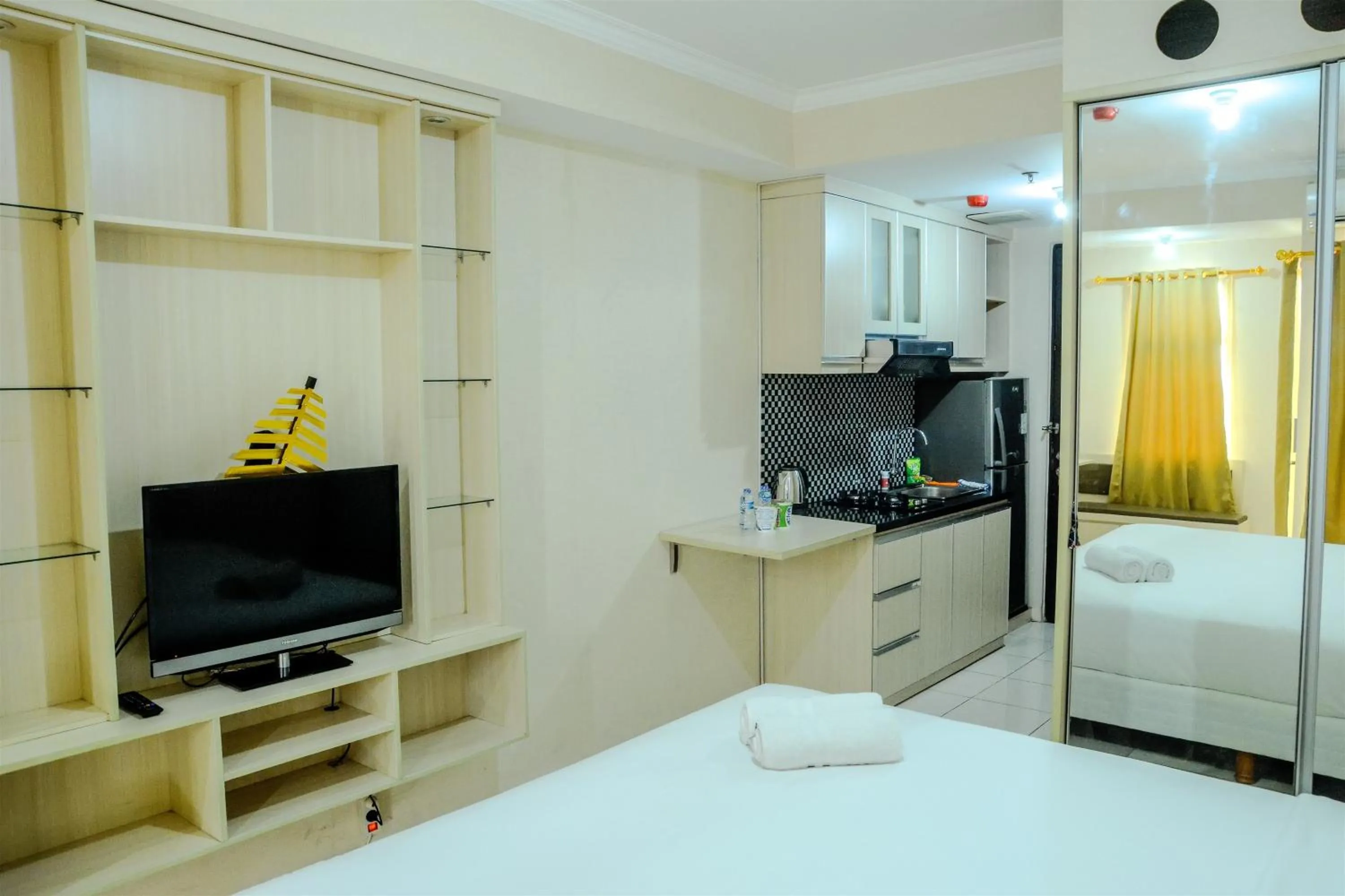 Property building, Bed in Minimalist Studio Room at Grand Serpong Apartment By Travelio
