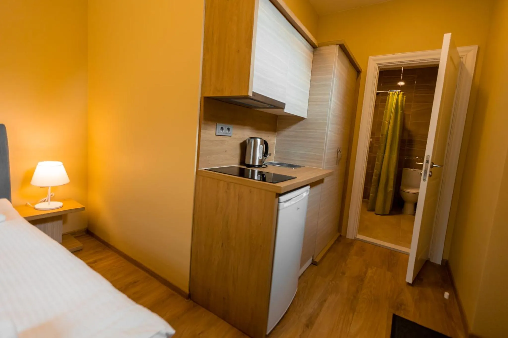 Kitchen or kitchenette, Bed in Hotel Palanga Camping