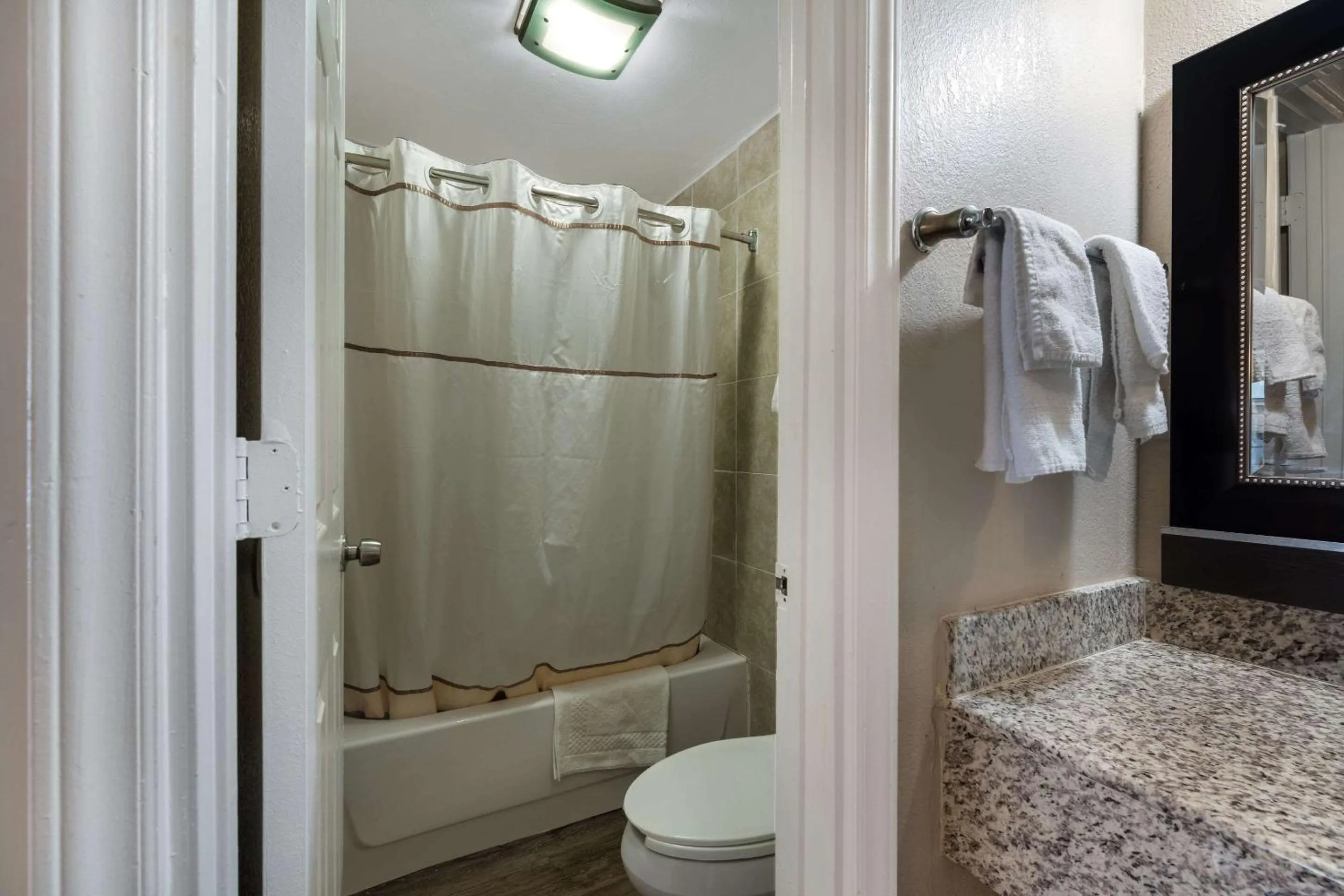 Bedroom in Rodeway Inn Charlotte Airport Area