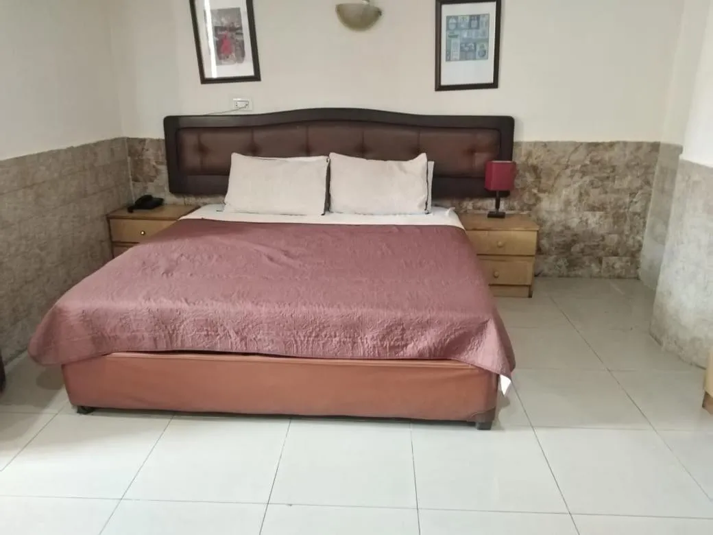 Bed in Amman Palace Hotel