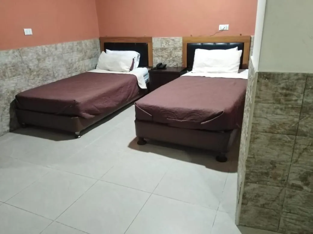 Bed in Amman Palace Hotel