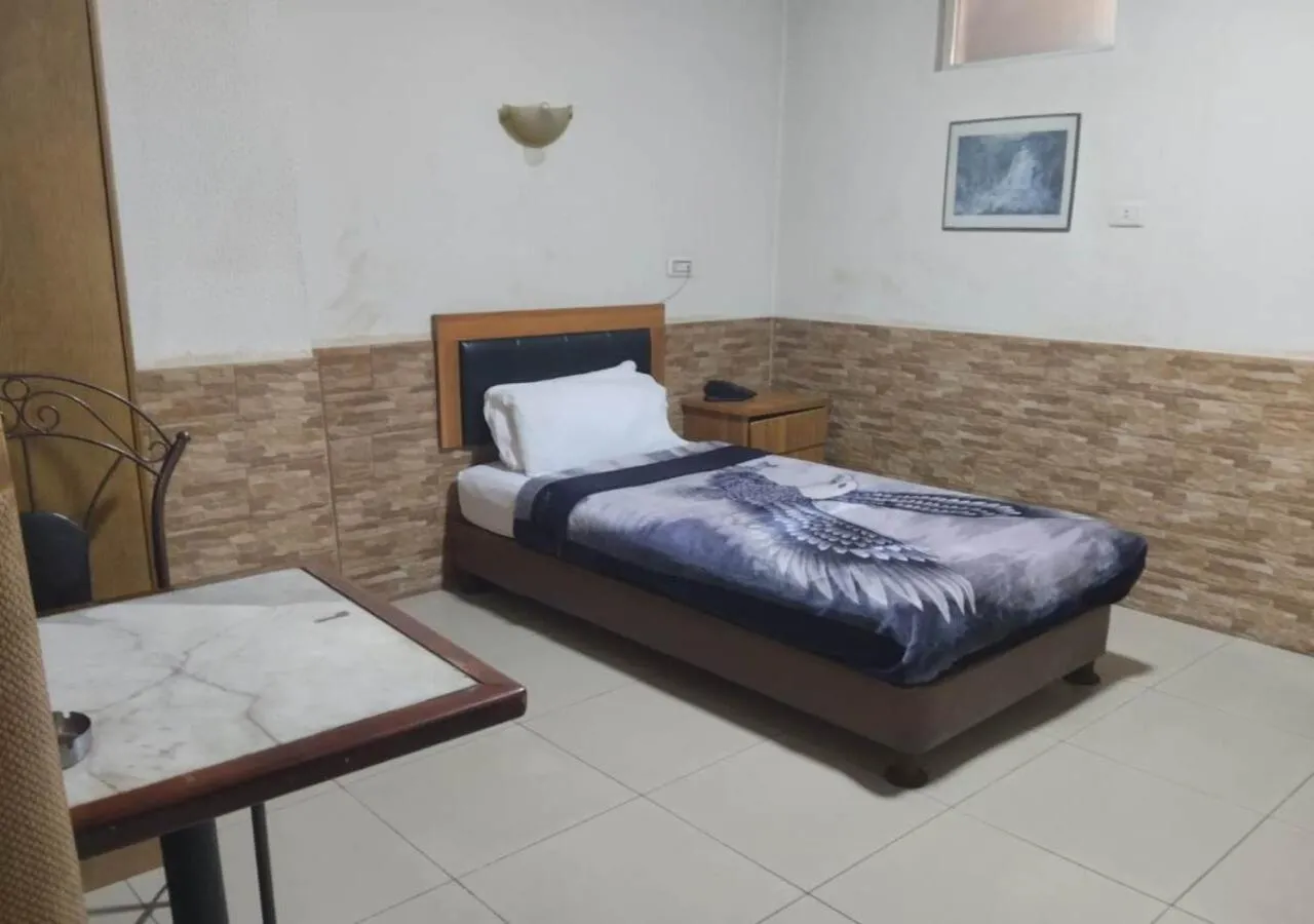 Bed in Amman Palace Hotel