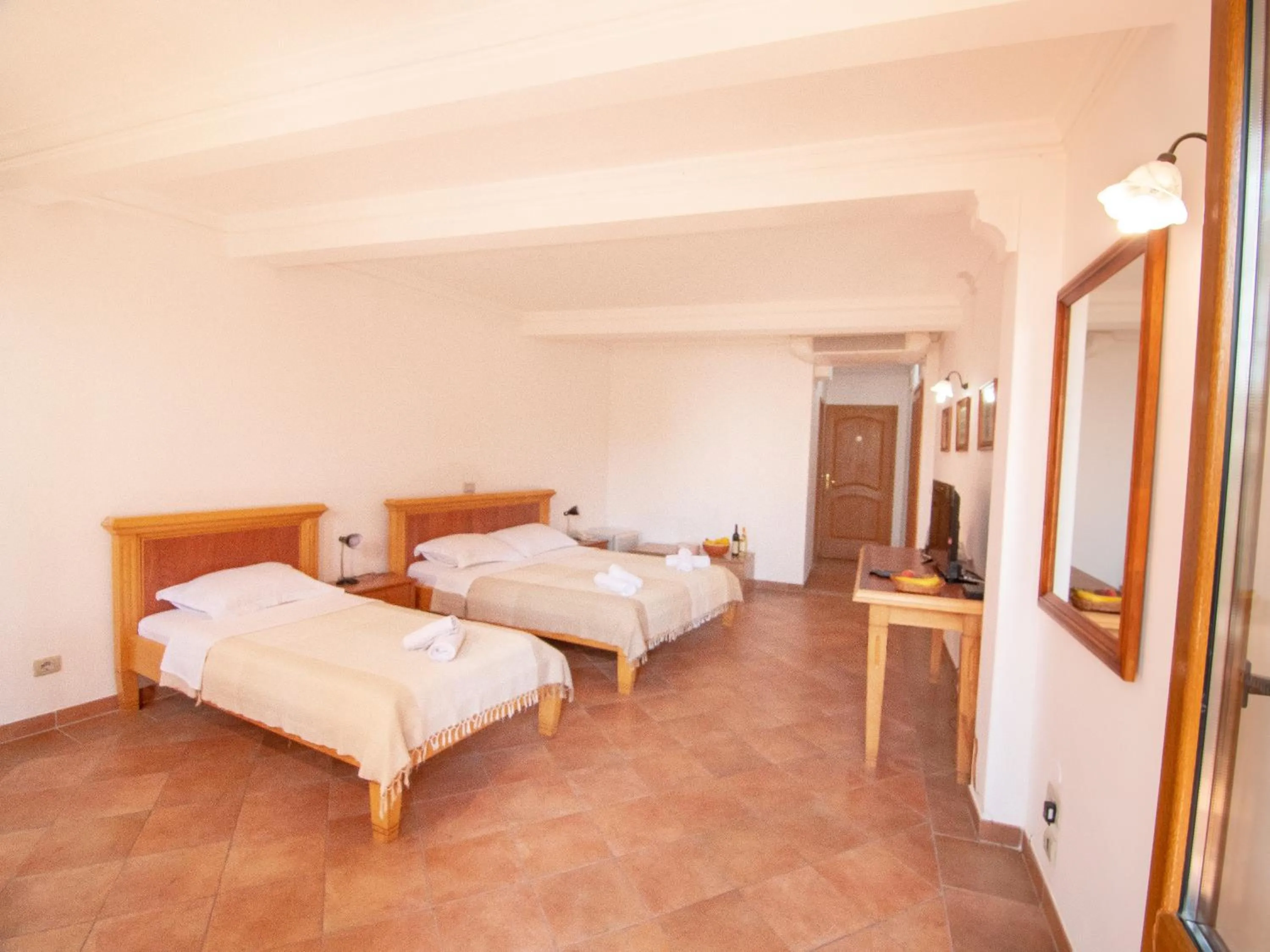 Triple Room with Pool View in Apartments and Rooms Levantin Inn