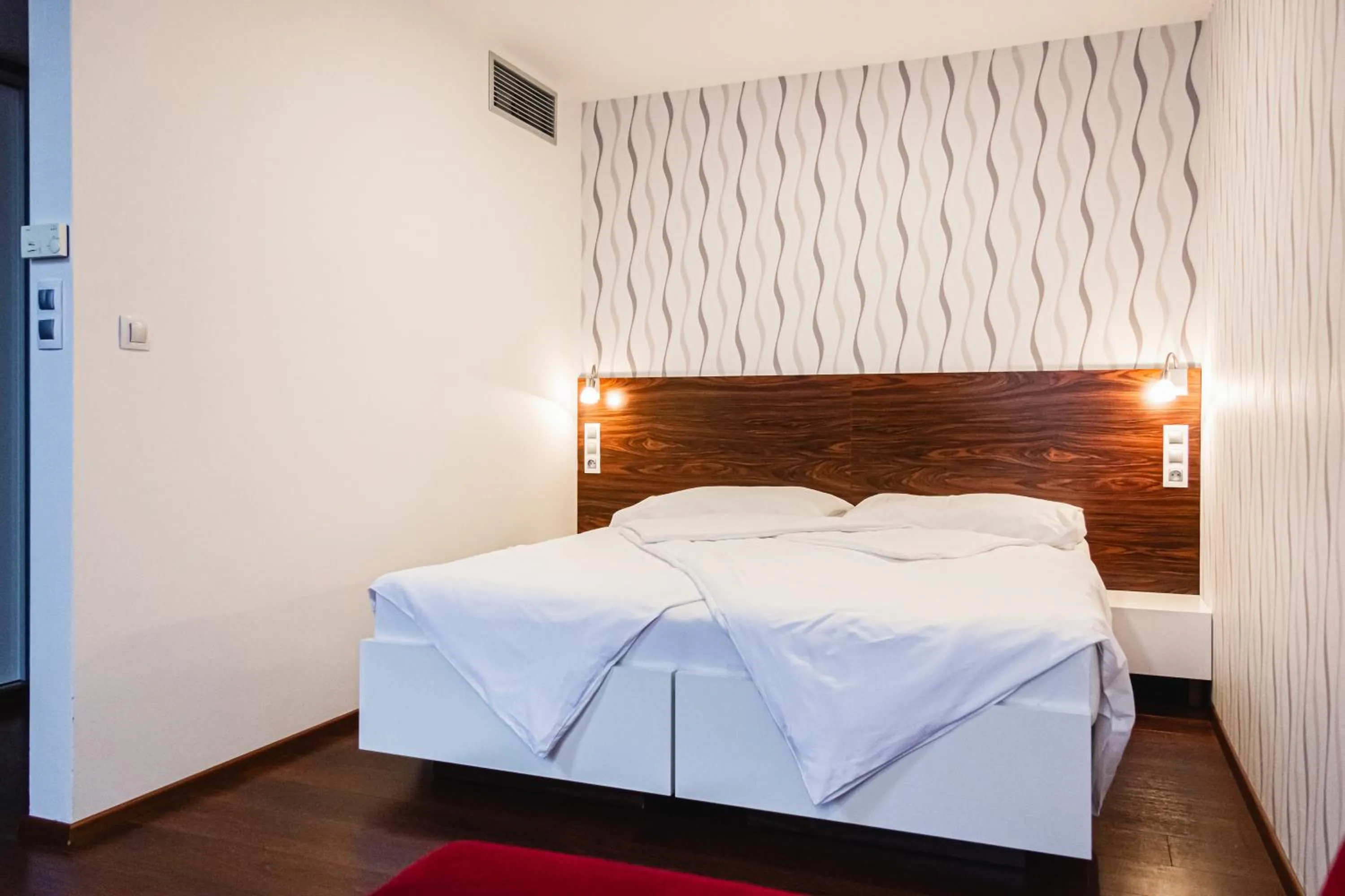 Bed in Hotel Pivovar