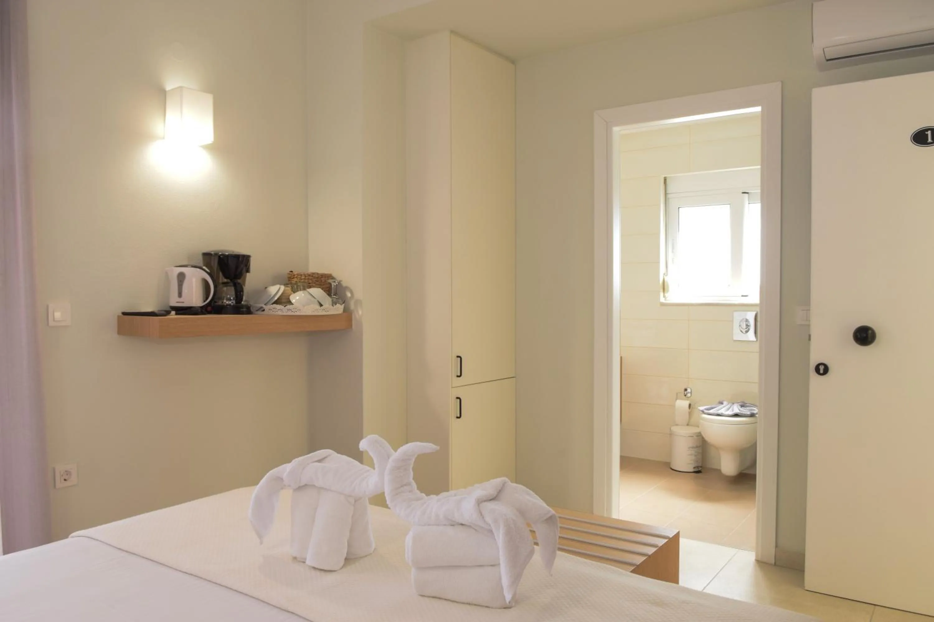 Bed in Mithos Premium Rooms