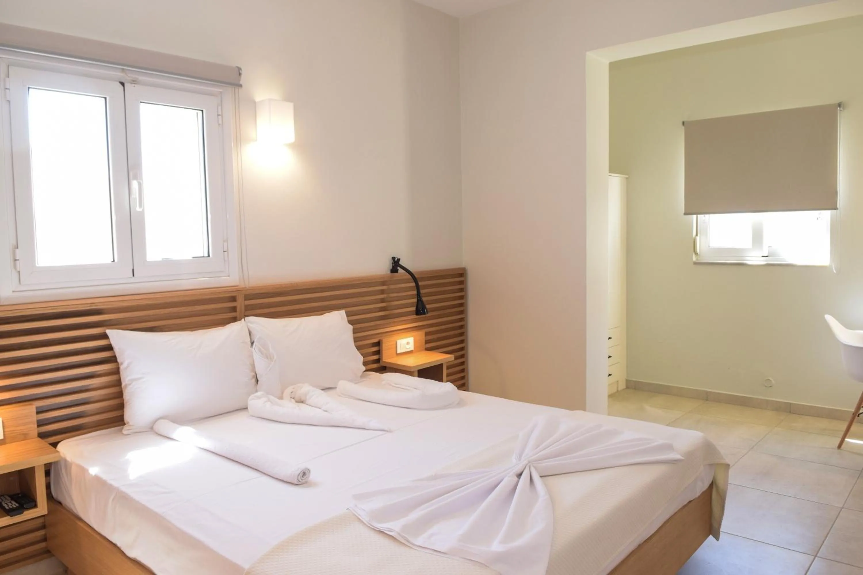 Bed in Mithos Premium Rooms